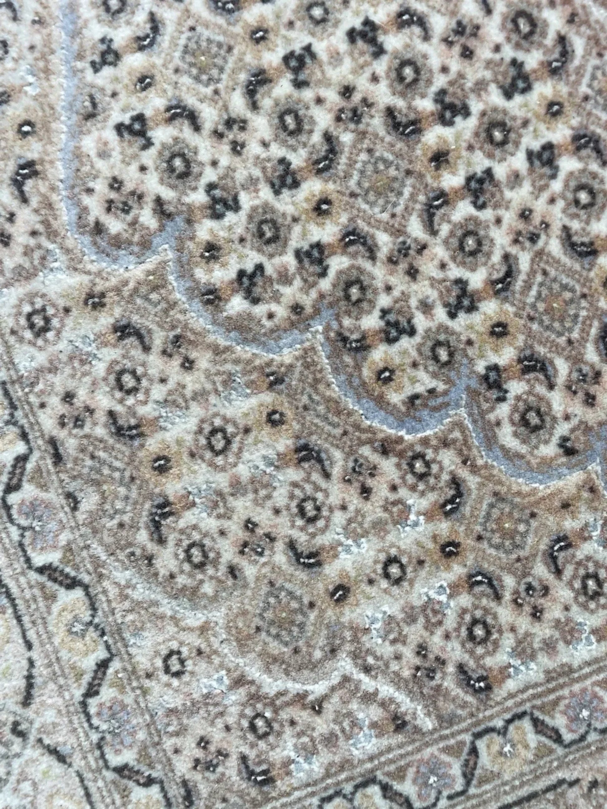 Silk threads catching light in floral motifs

