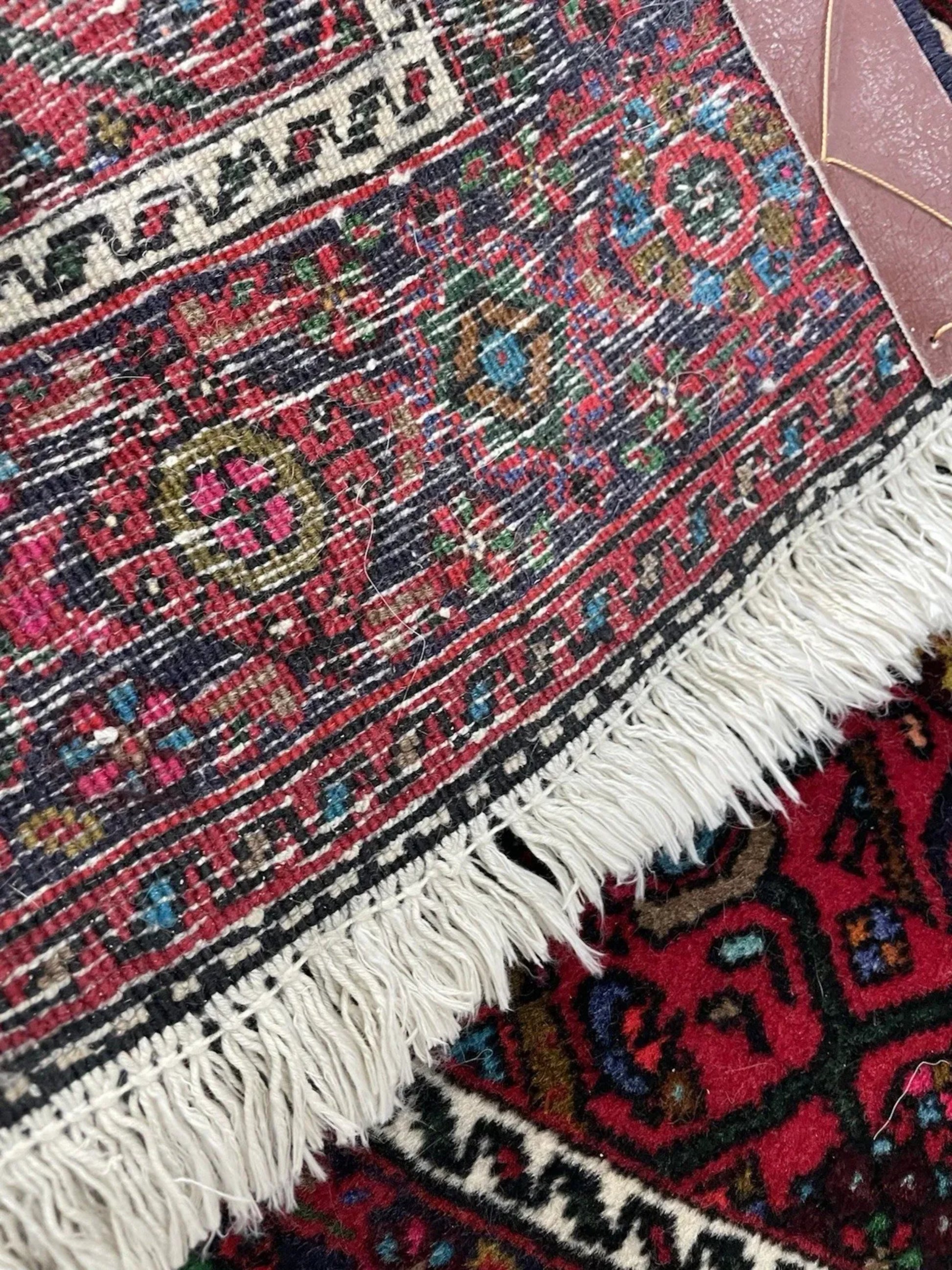 Color contrast between red field and dark motifs

