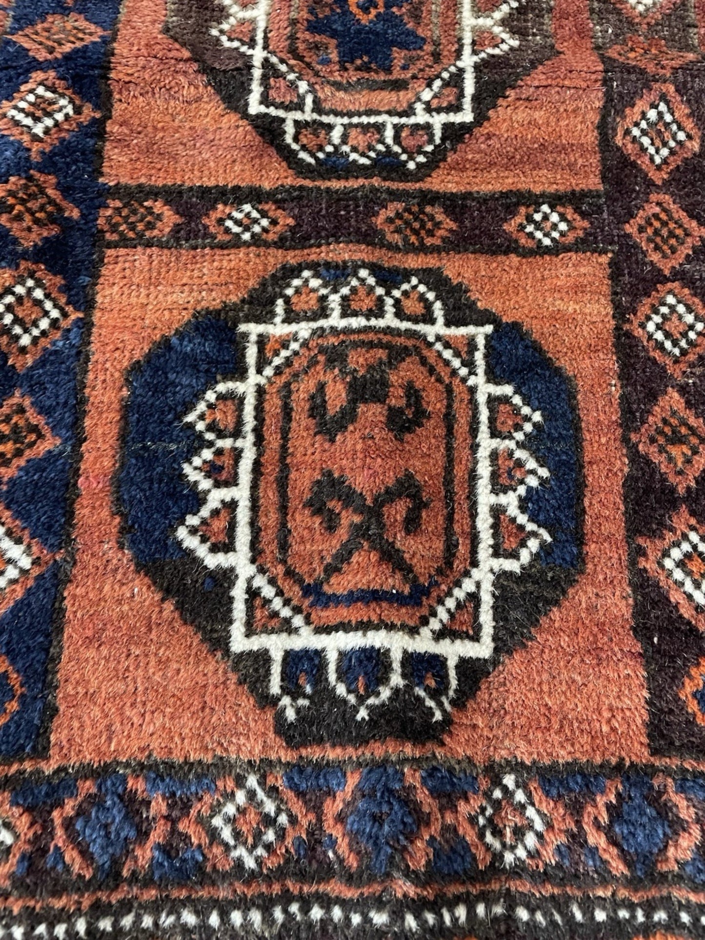 Macro detail showing the age-appropriate wear and soft, low pile.

