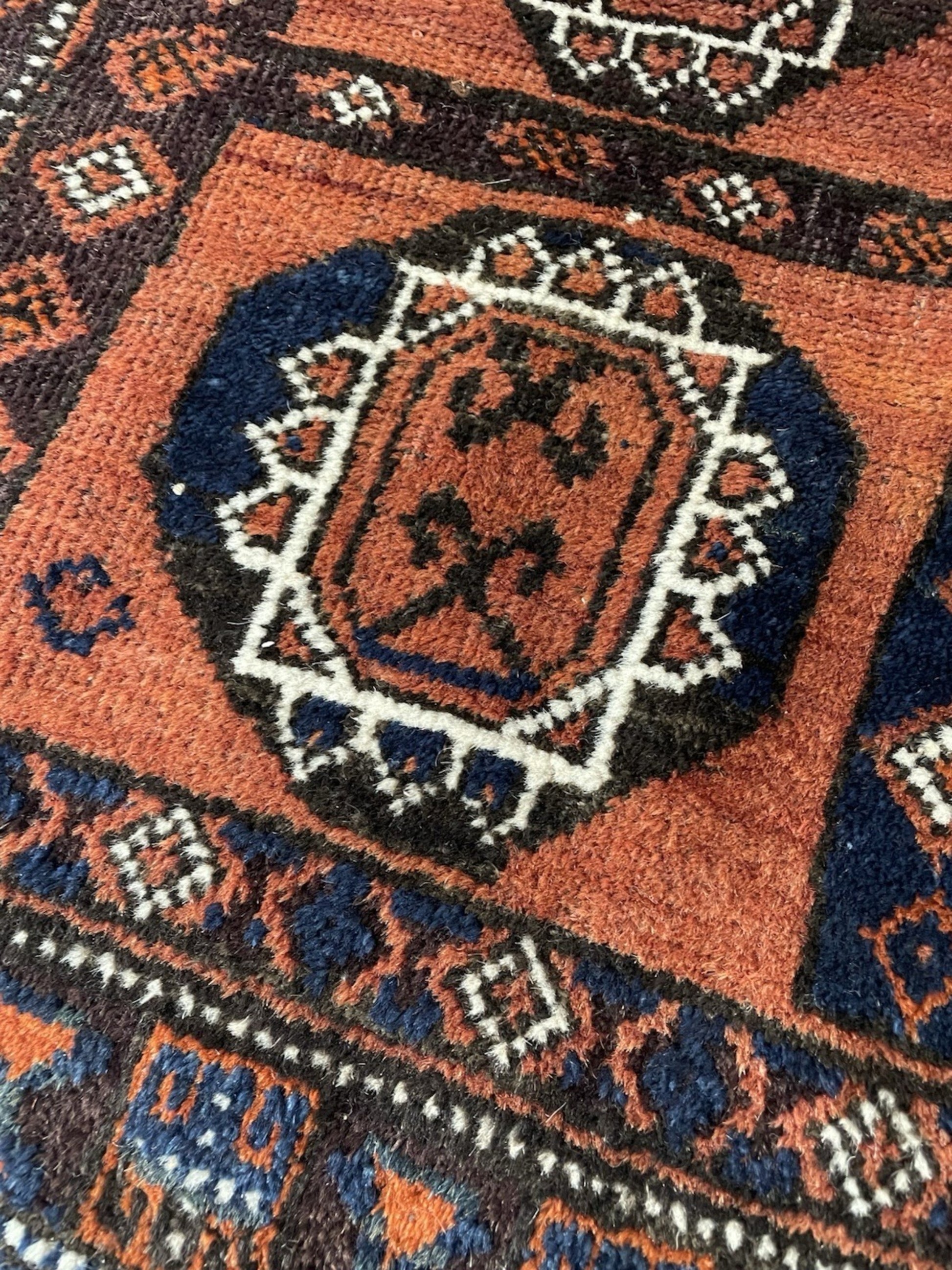 The back of the rug showing the tight hand-knotted construction.

