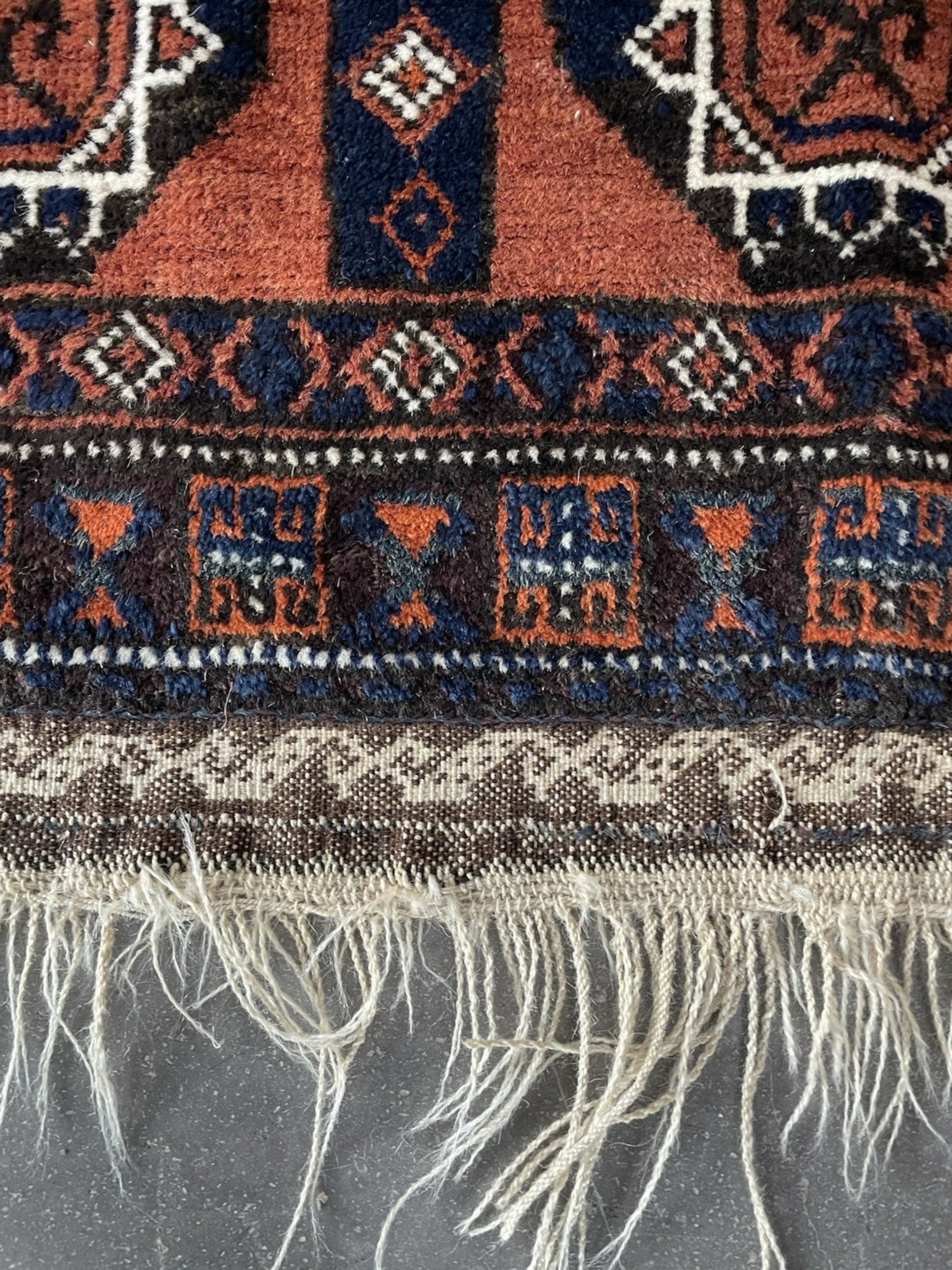 Diagonal angle view of the entire rug showing its rectangular shape.

