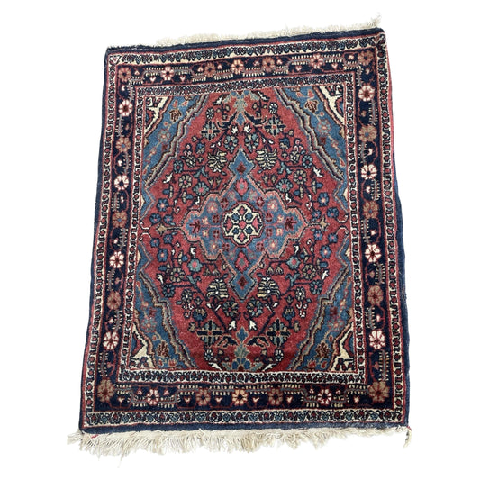 Full front view of the antique Persian Hamadan rug showing its complete geometric design.

