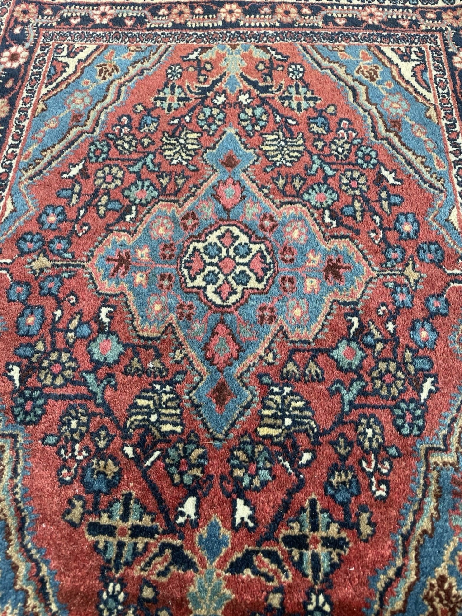 The reverse side of the rug displaying the tight cotton foundation.

