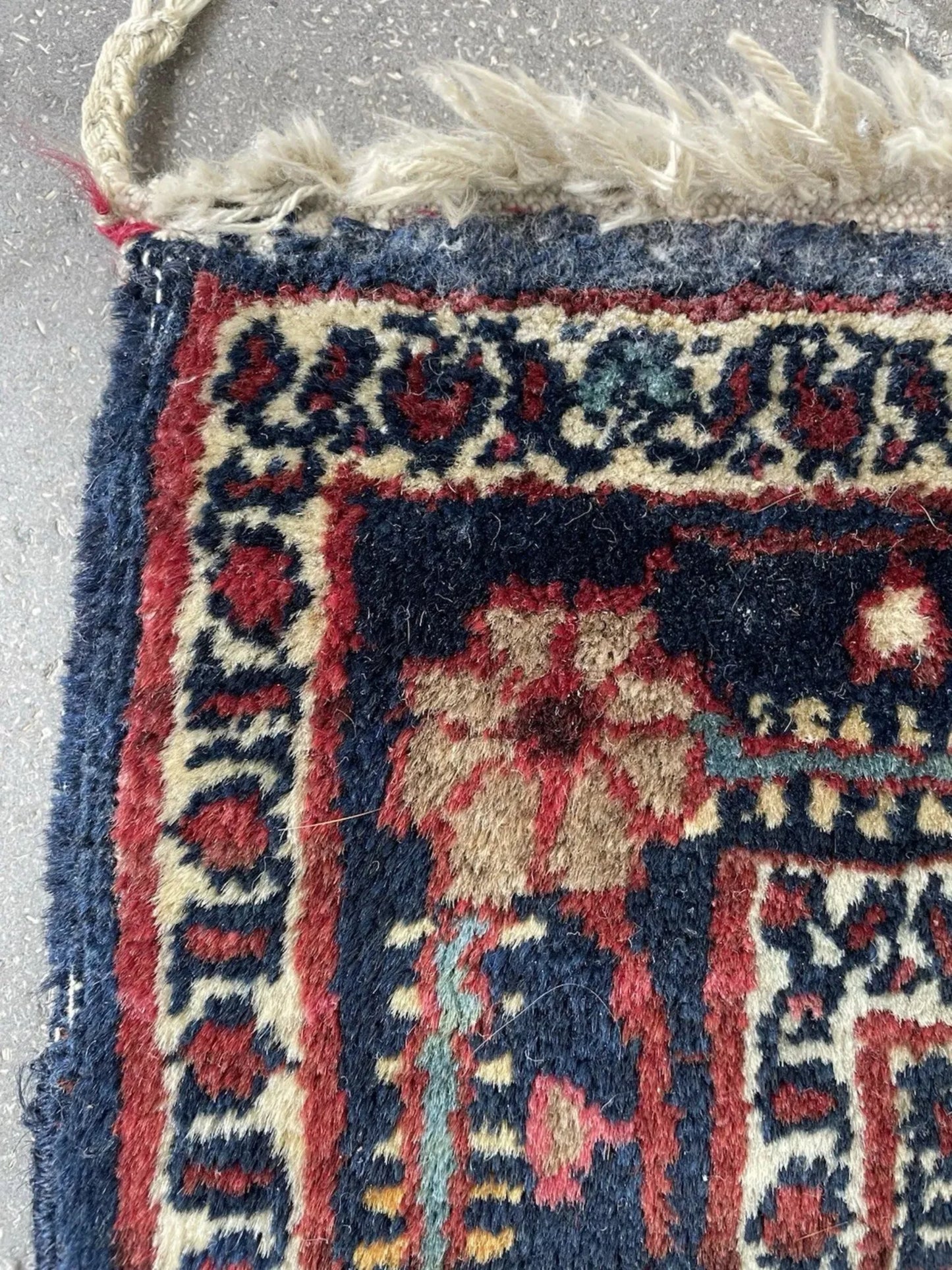 Diagonal angle view of the entire rug highlighting its near-square shape.

