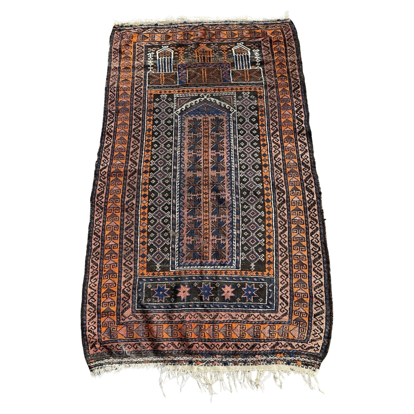 Full front view of the antique Baluch prayer rug showing the Mihrab arch.

