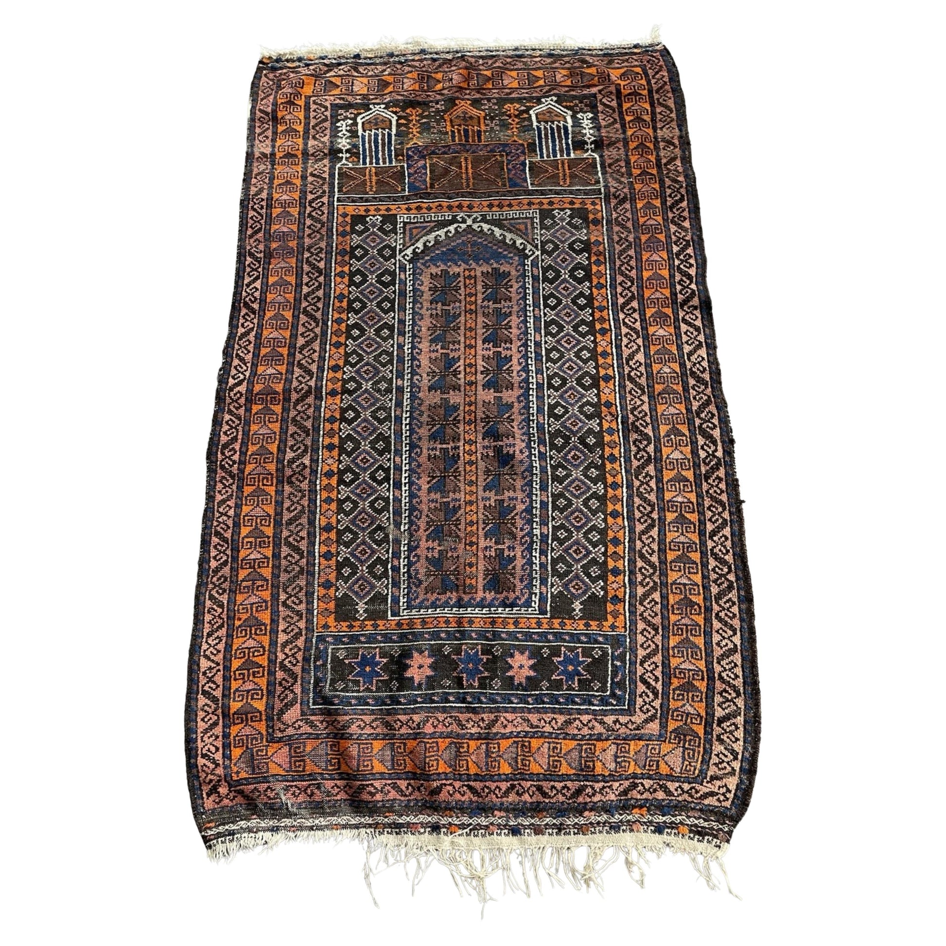 Full front view of the antique Baluch prayer rug showing the Mihrab arch.

