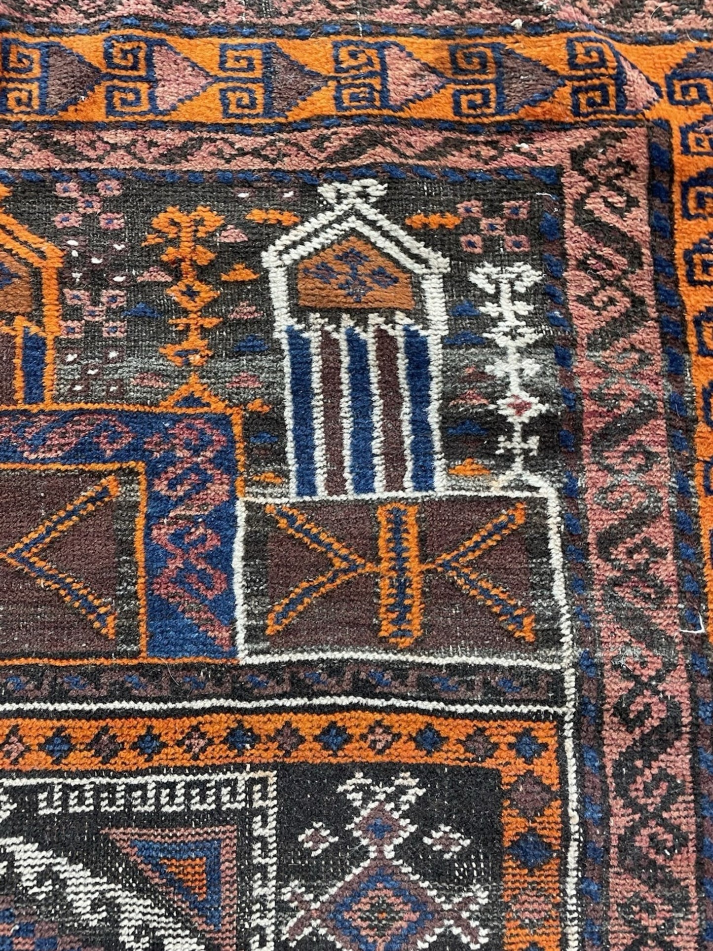 Overall presentation of the rug as a decorative wall hanging.

