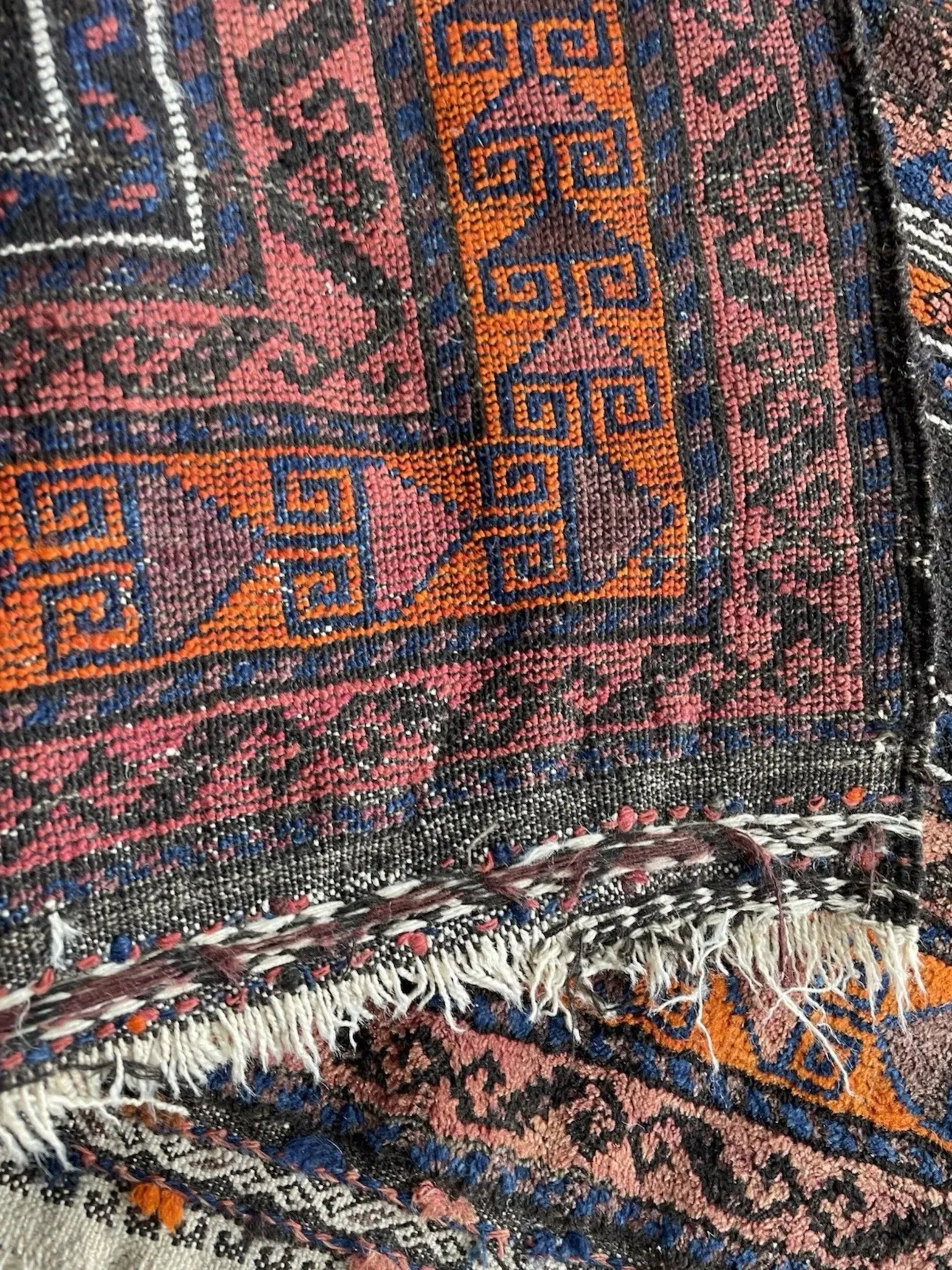 Detailed shot of the border design and repeating geometric figures.

