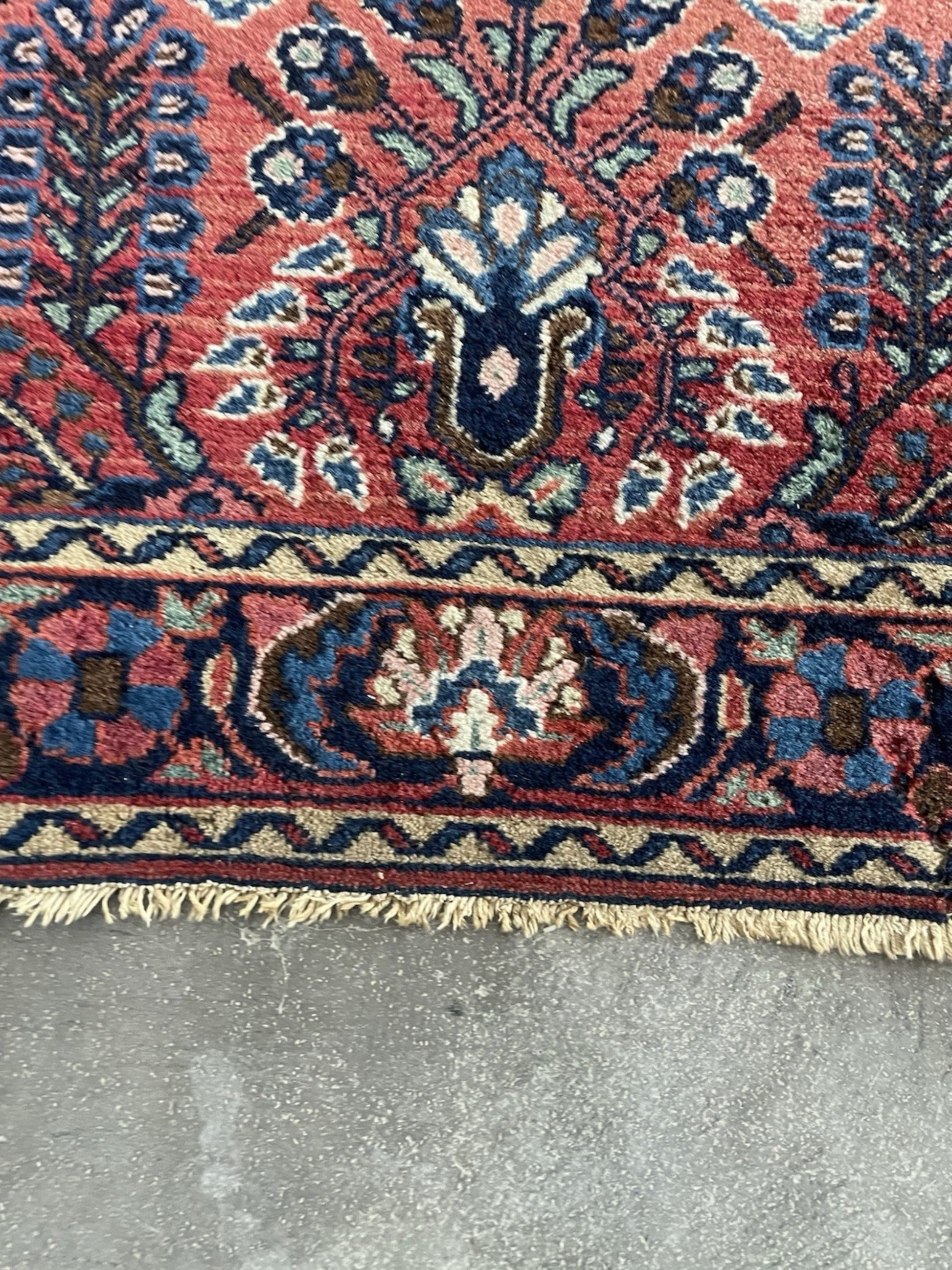 The back of the rug revealing the fine, consistent knotting.

