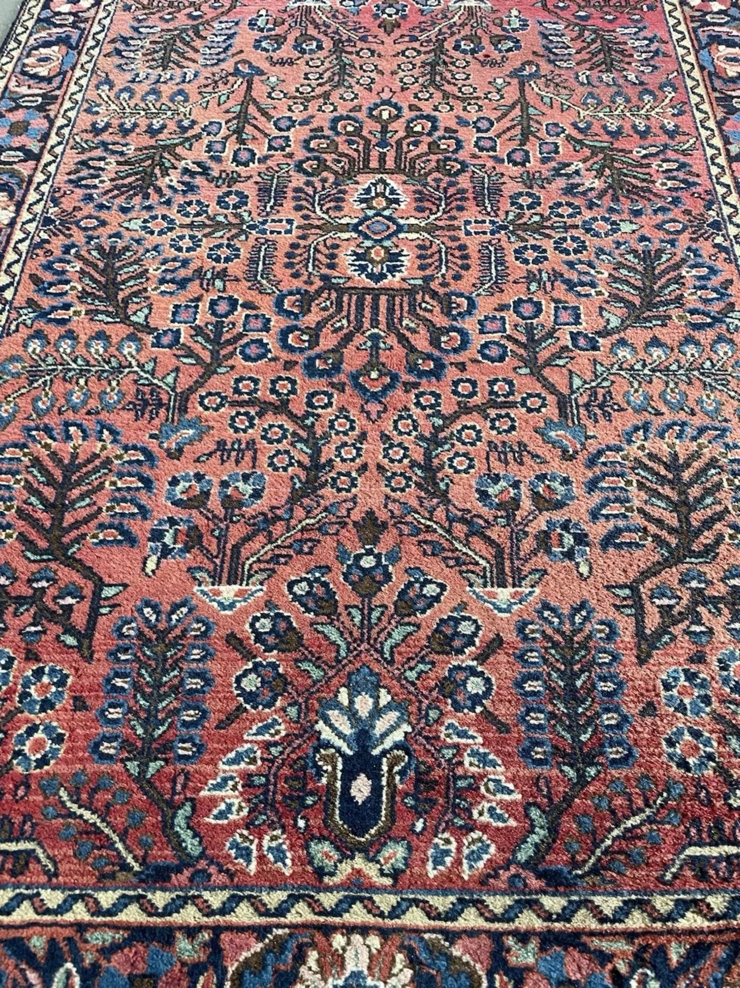 Side angle view showing the rug's dense, luxurious wool pile.

