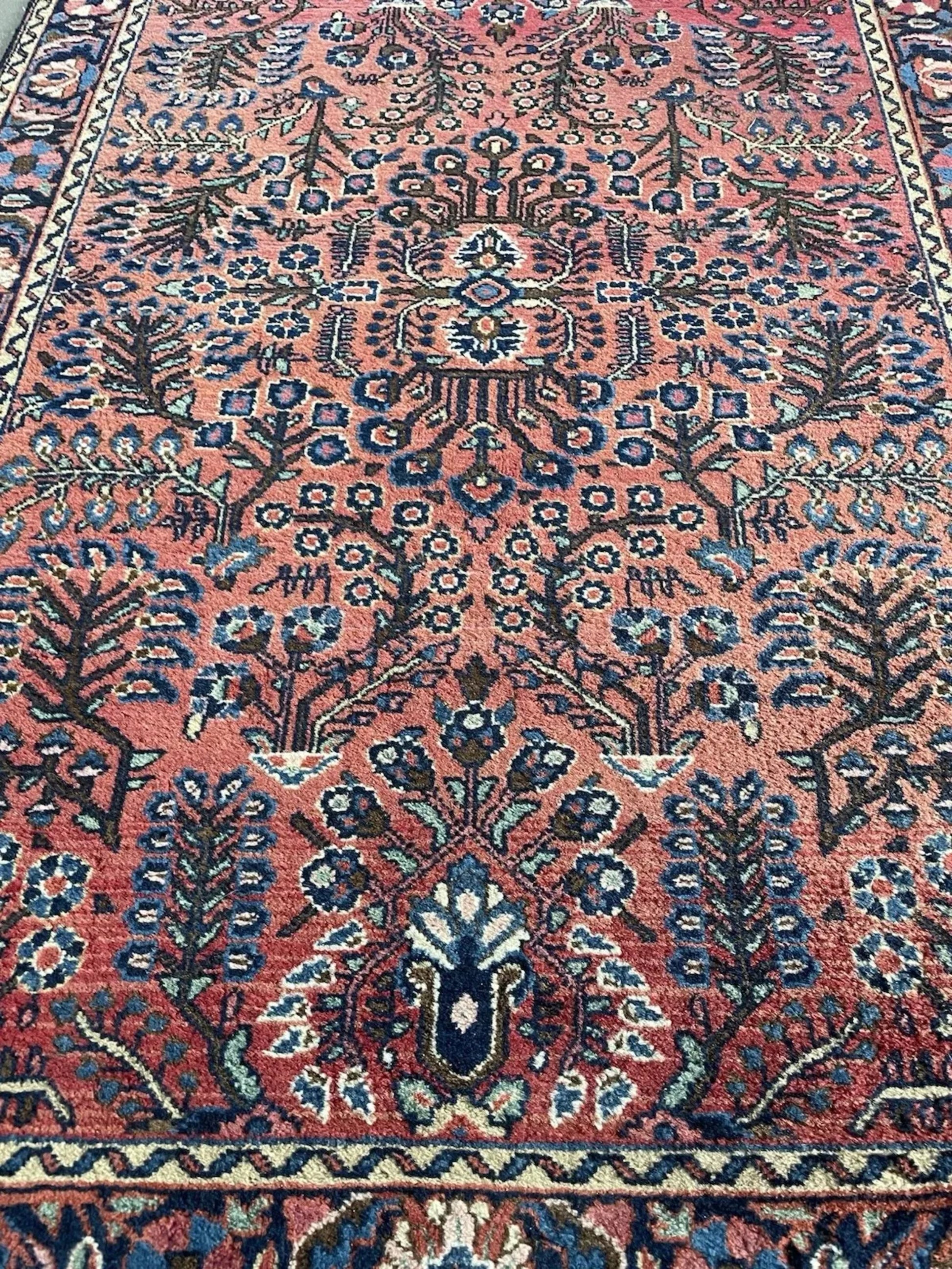 Side angle view showing the rug's dense, luxurious wool pile.

