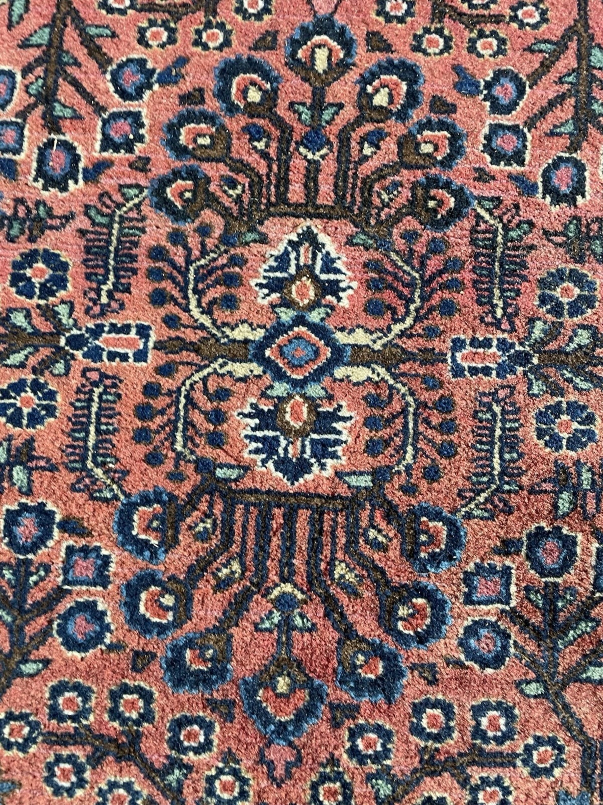 Diagonal angle view of the entire rug showcasing its balanced composition.

