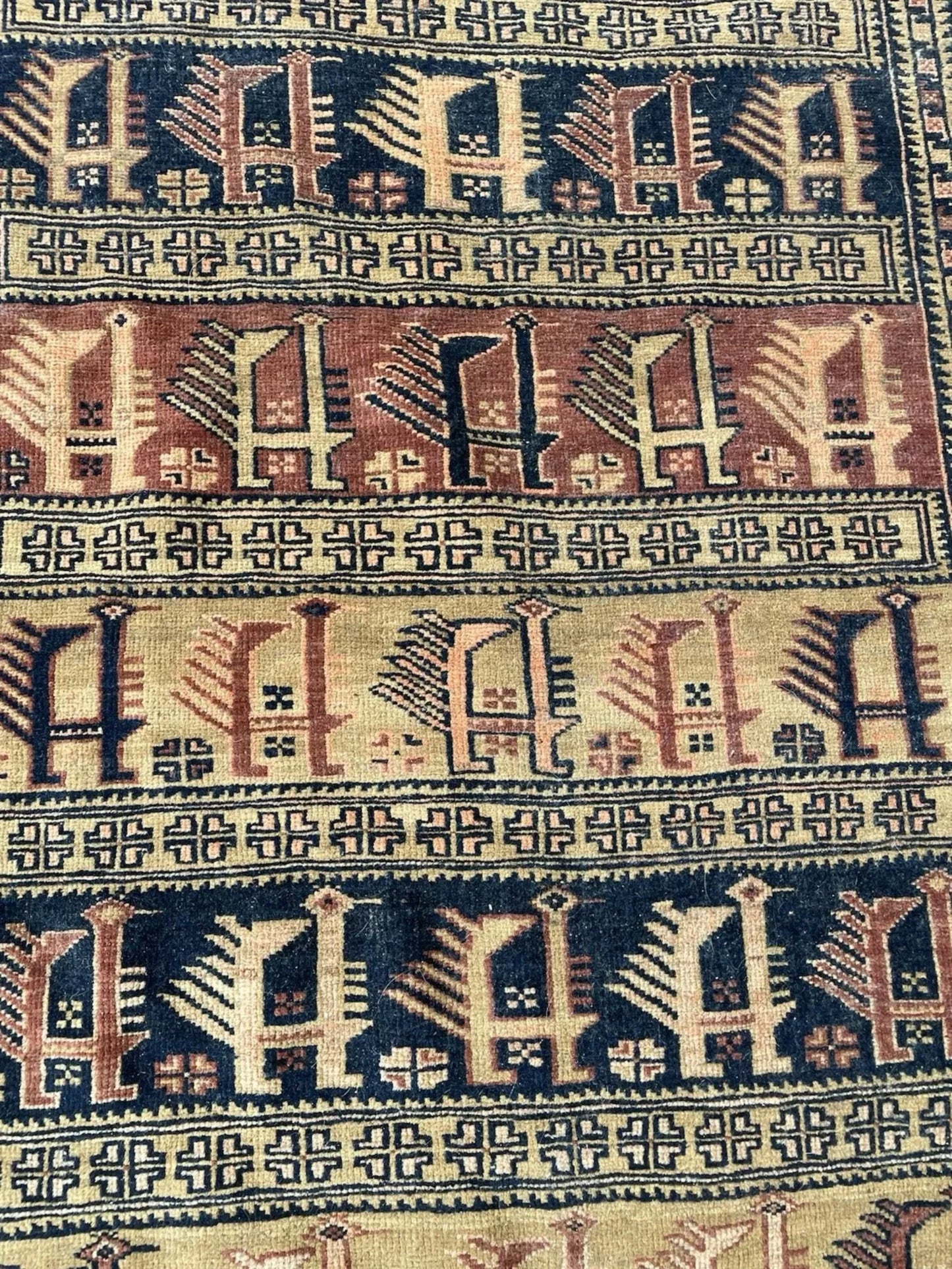 Afghan Baluch rug border detail featuring geometric patterns and authentic 1920s tribal weaving techniques