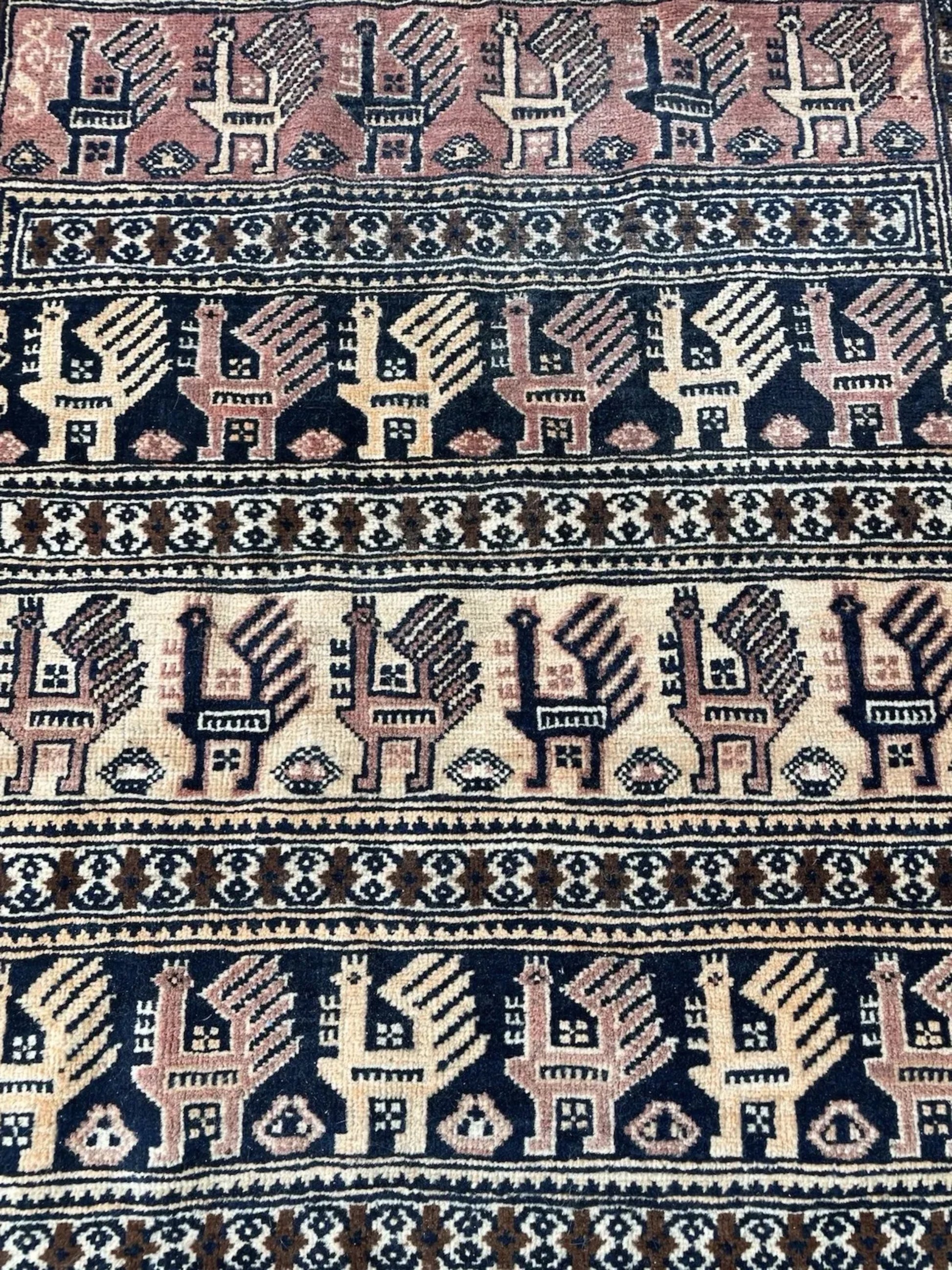 Side view of the rug showing its profile and sturdy wool foundation.

