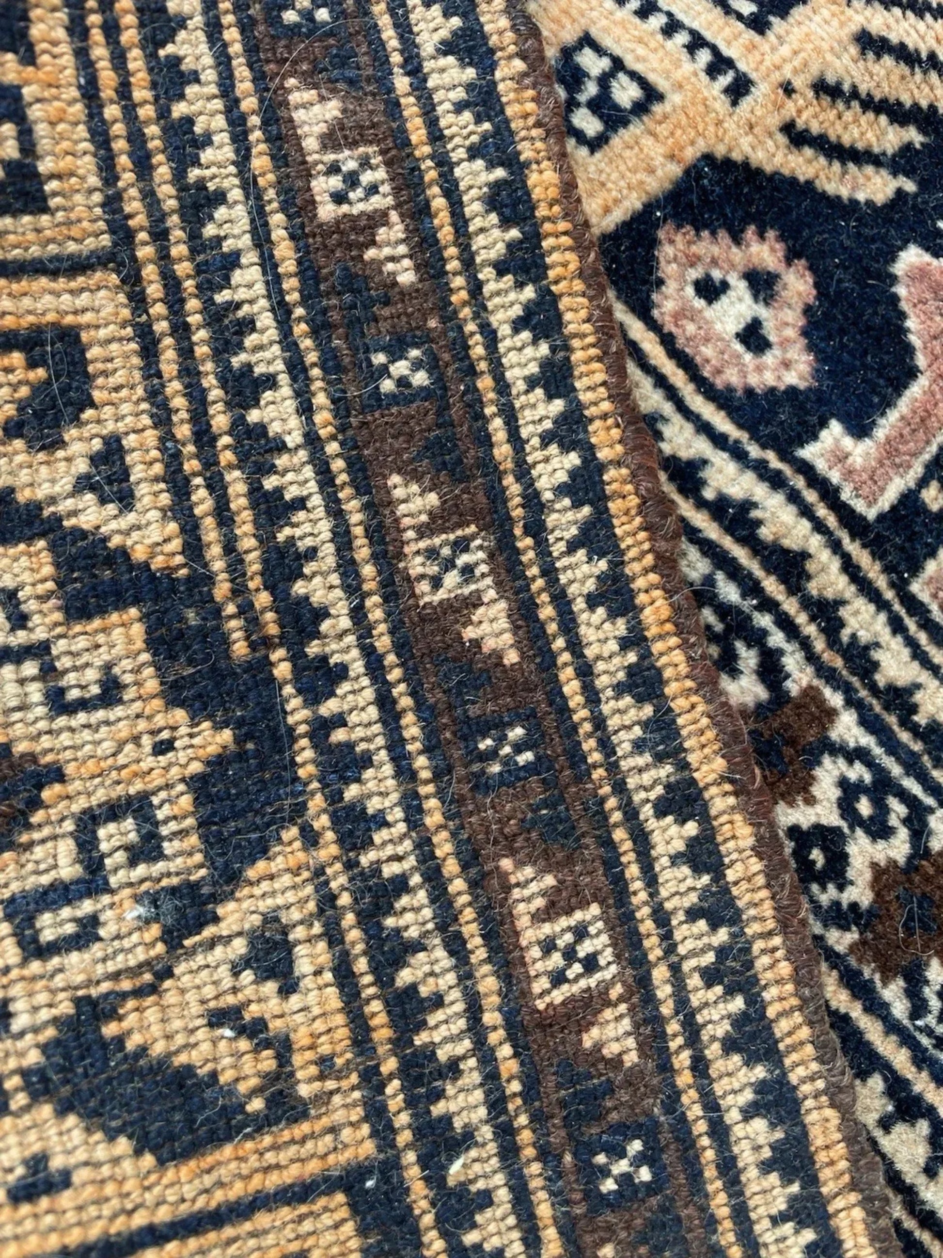 The rug displayed in a hallway setting showcasing its runner proportions.

