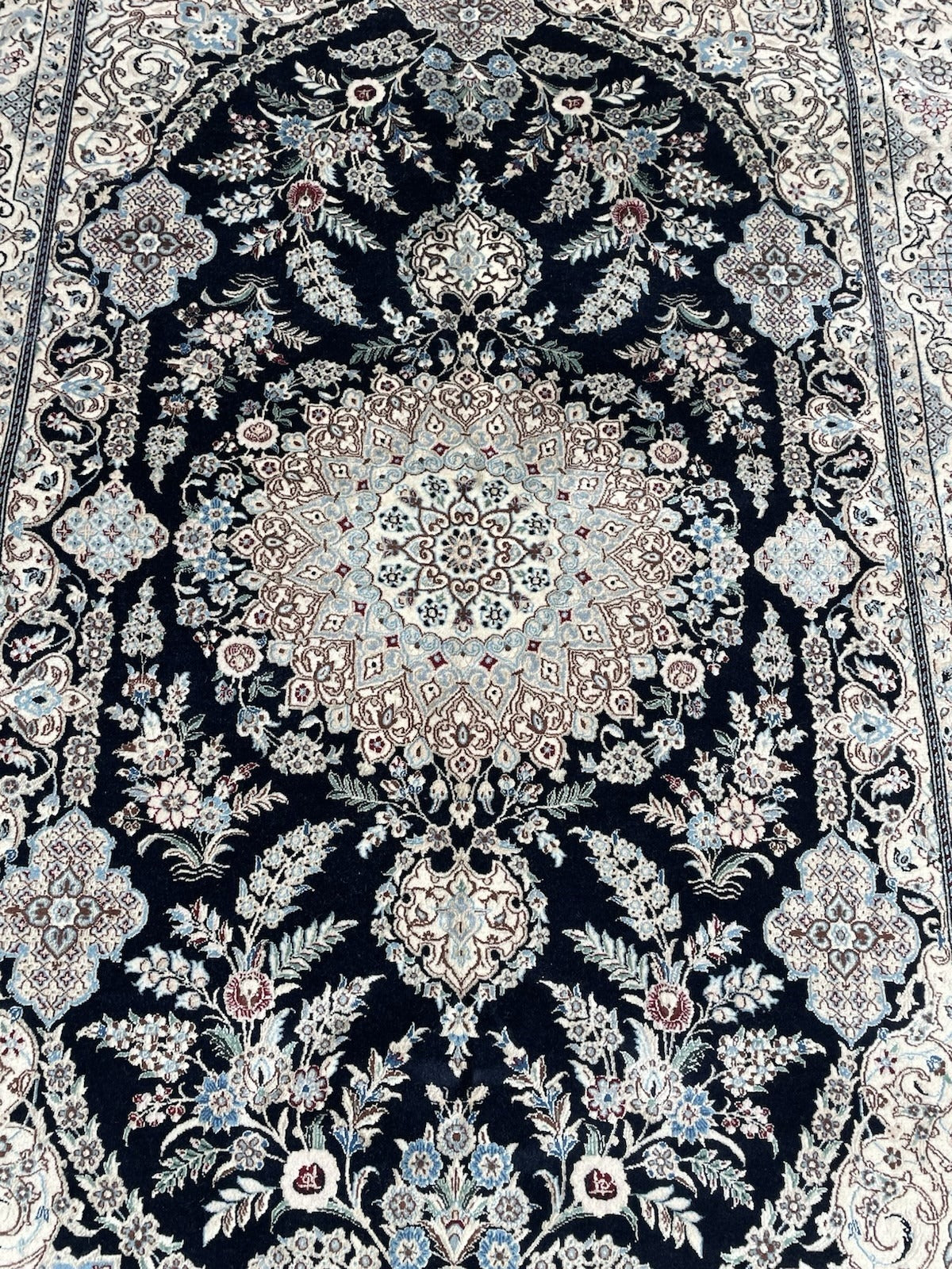 High-quality vintage rug weave demonstrating fine craftsmanship, dense pile, and detailed floral precision.

