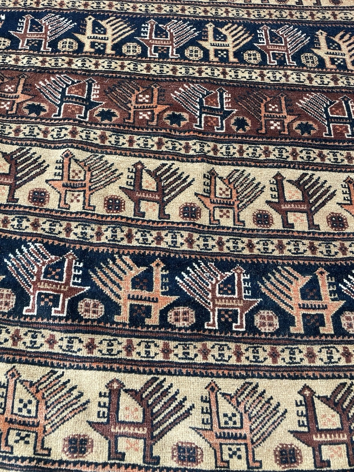 Good antique condition 1920s Baluch rug showing age-related wear, minor irregularities, visible fringe wear, and desirable patina.

