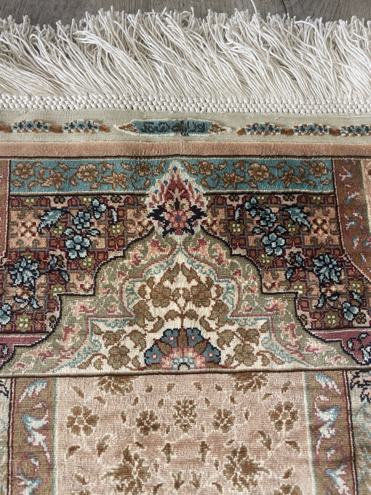 Handmade extra fine Hereke silk rug with olive, ivory, and rose tones, reflecting classical Ottoman Hereke aesthetics.

