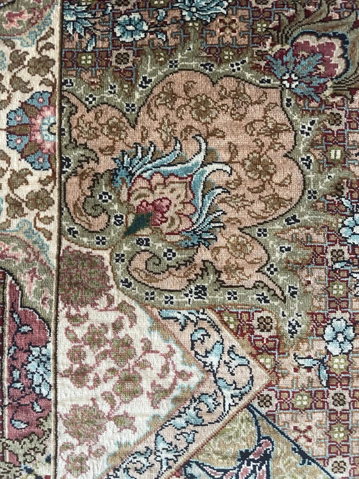 Small vintage Turkish Hereke silk rug measuring 2.1 x 3.1 feet with ornate corner spandrels and a luminous silk sheen.

