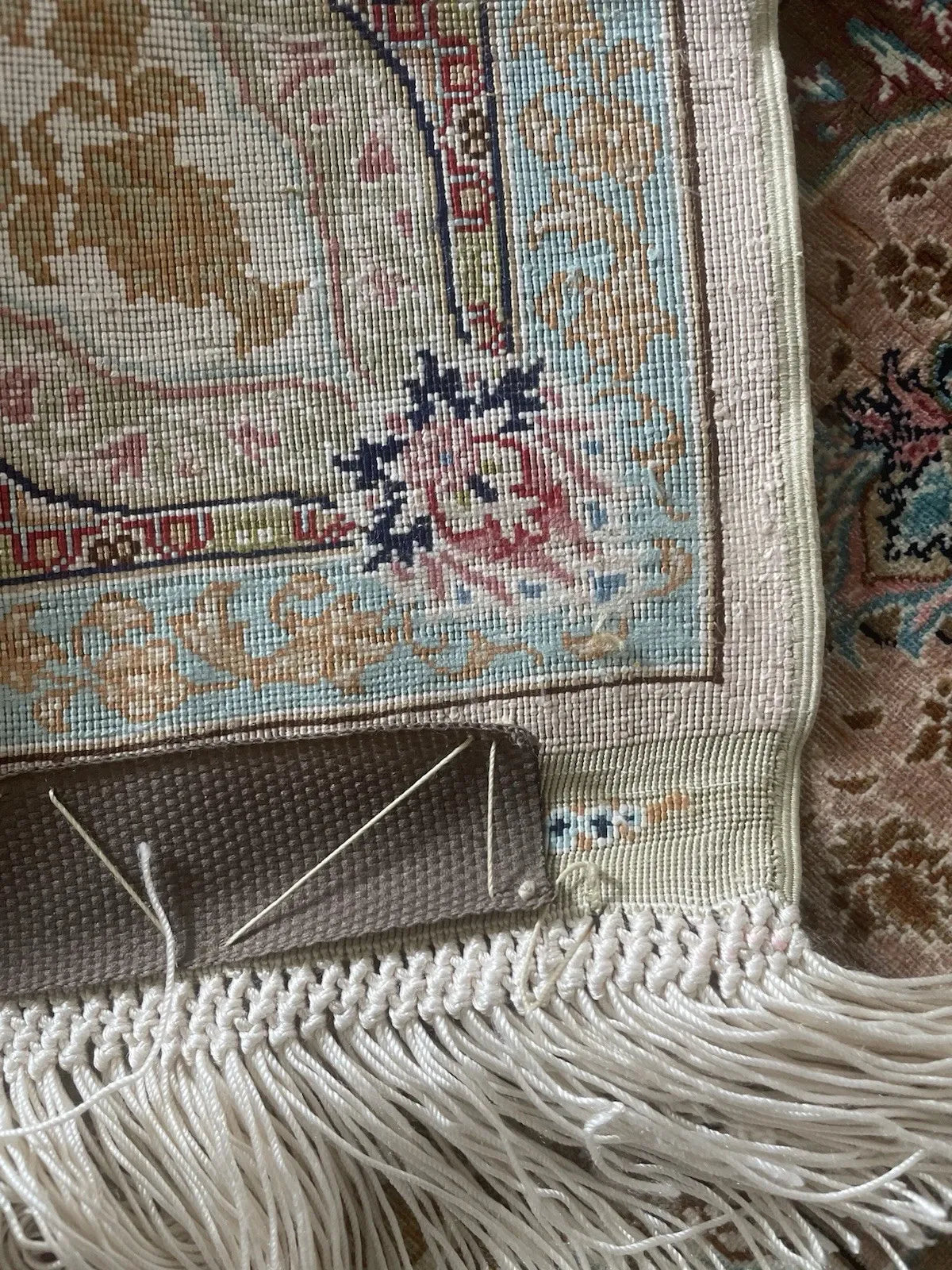 Antique-style signed Hereke silk rug with radial symmetry, dense micro-pattern detailing, and multiple decorative borders.

