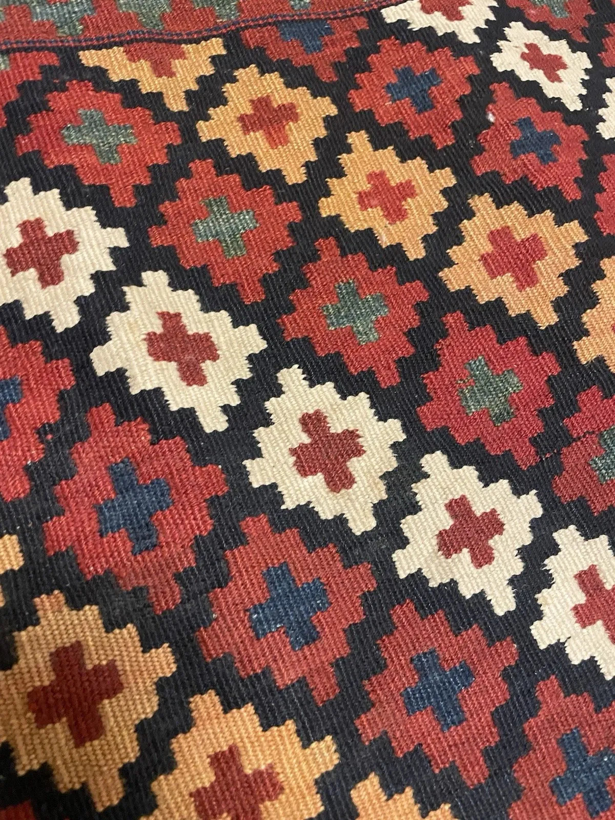 Antique wool flatweave from the Zagros Mountains region, tightly spun and lustrous from high-altitude flocks, with natural dyes (madder, indigo, weld/pomegranate) aged to warm depth.

