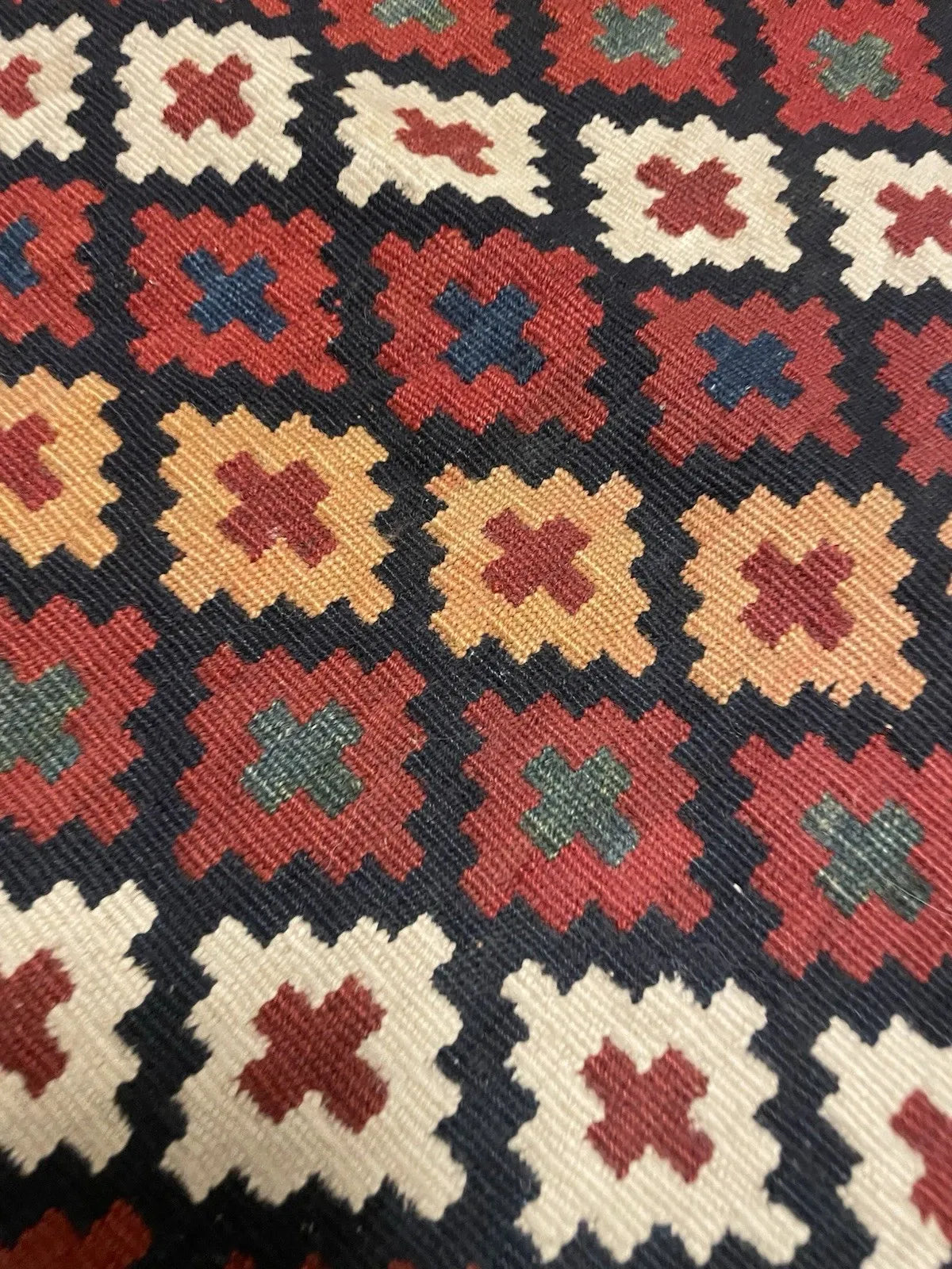 Antique Persian tribal textile from the Qashqai confederacy, circa 1900, in fair to good condition for age, with well-preserved crisp borders and a central field showing honest age wear.

