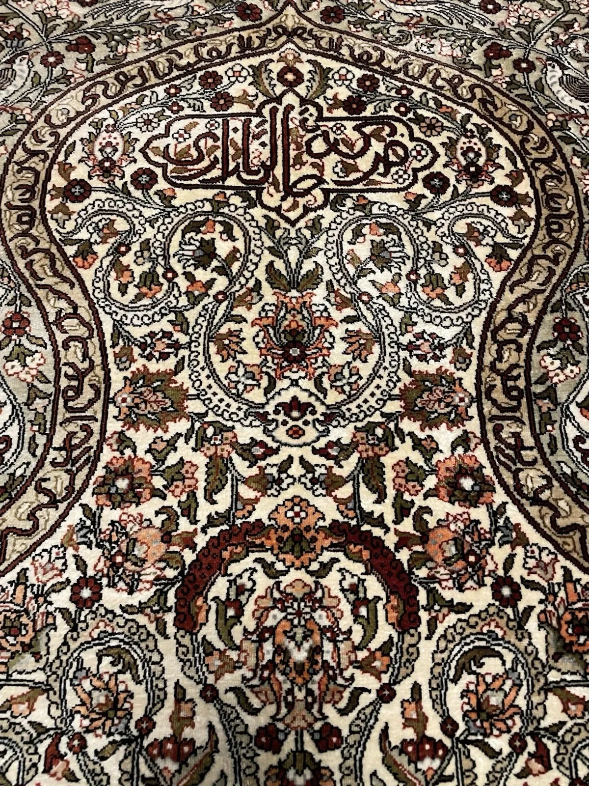 Vintage pure silk prayer rug (namazlık) from Hereke, Turkey, measuring 4'1" × 2'6", silk pile on silk foundation with Turkish symmetrical (Ghiordes) knots, in good to very good condition.

