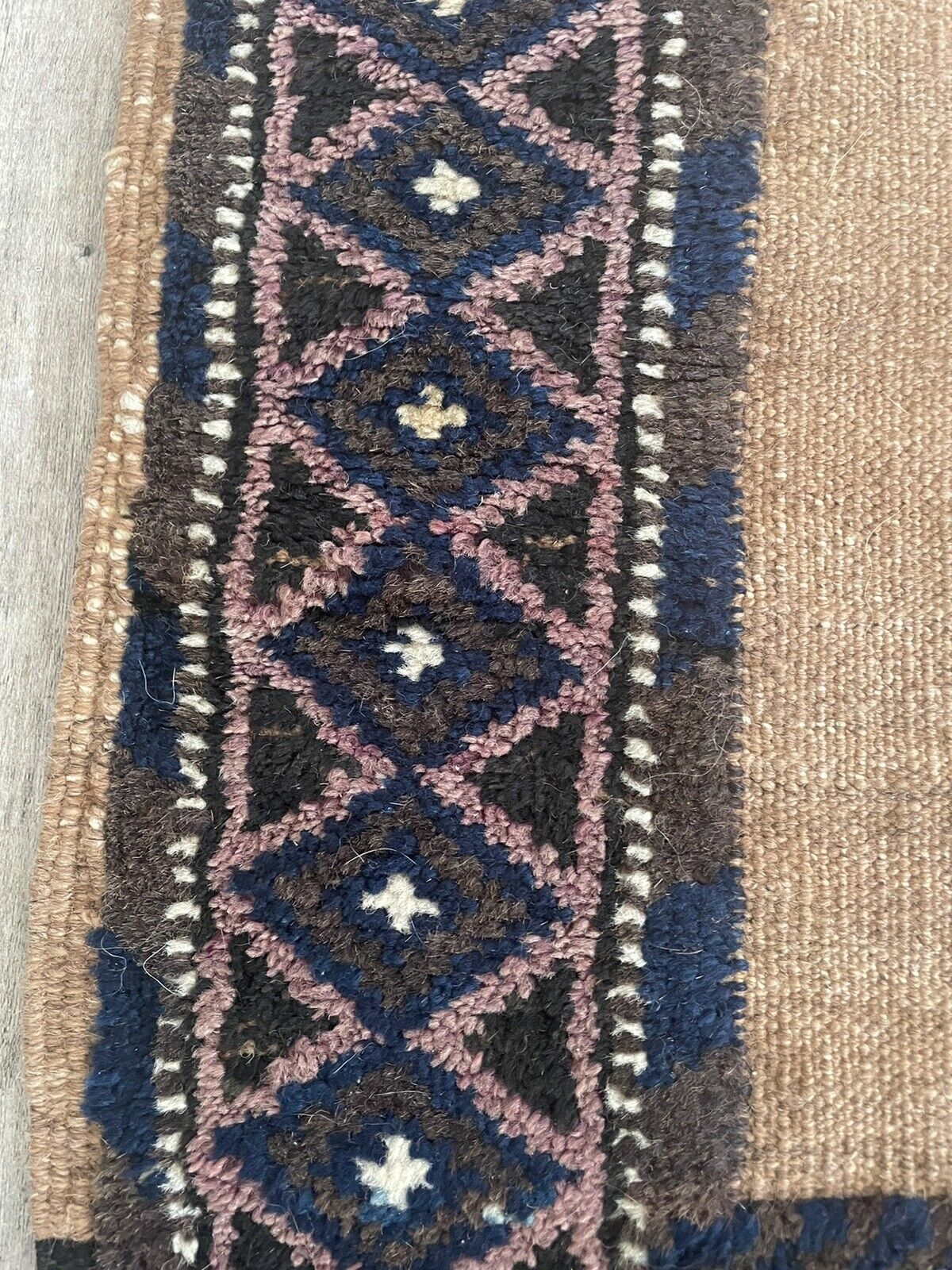 Close-up of fringe on Handmade Antique Afghan Baluch Collectible Rug - Detailed view showcasing the fringes at both ends of the rug, indicating its handmade nature and adding to its authenticity.