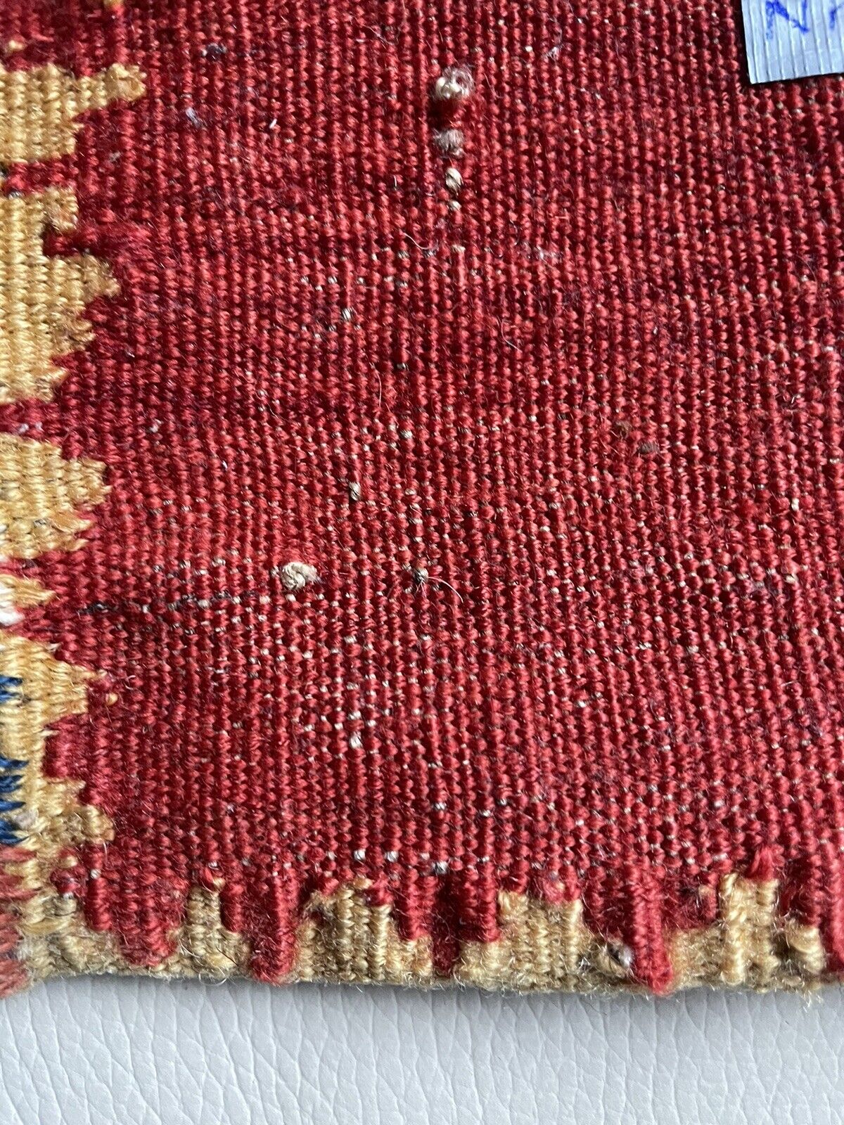 Backside of a handmade antique Persian Gashkai small bag (1900s) crafted from high-quality wool in good condition.