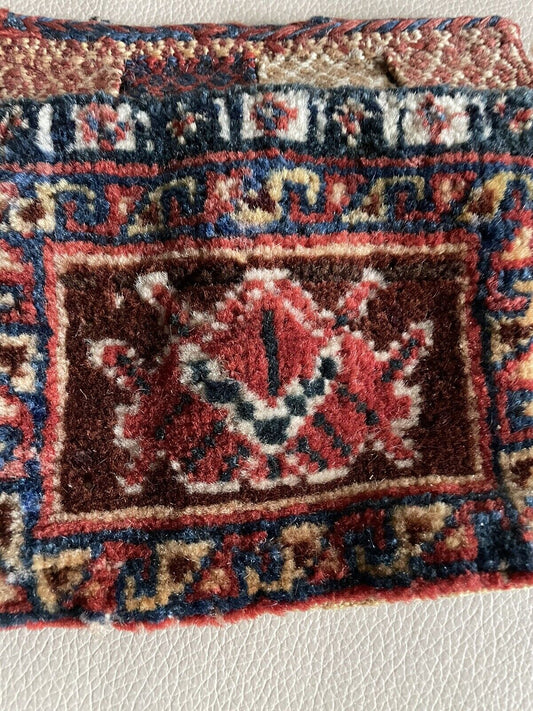Close-up of the central design with its elaborate arrangement in deep red.
