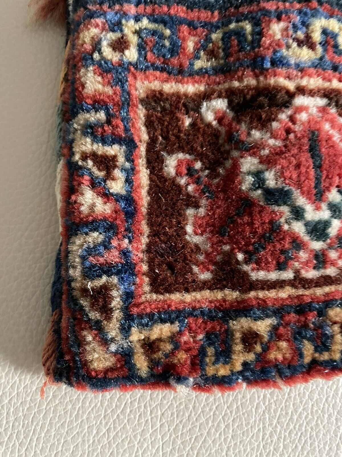 Close-up of the geometric shapes incorporated into the bag's patterns.