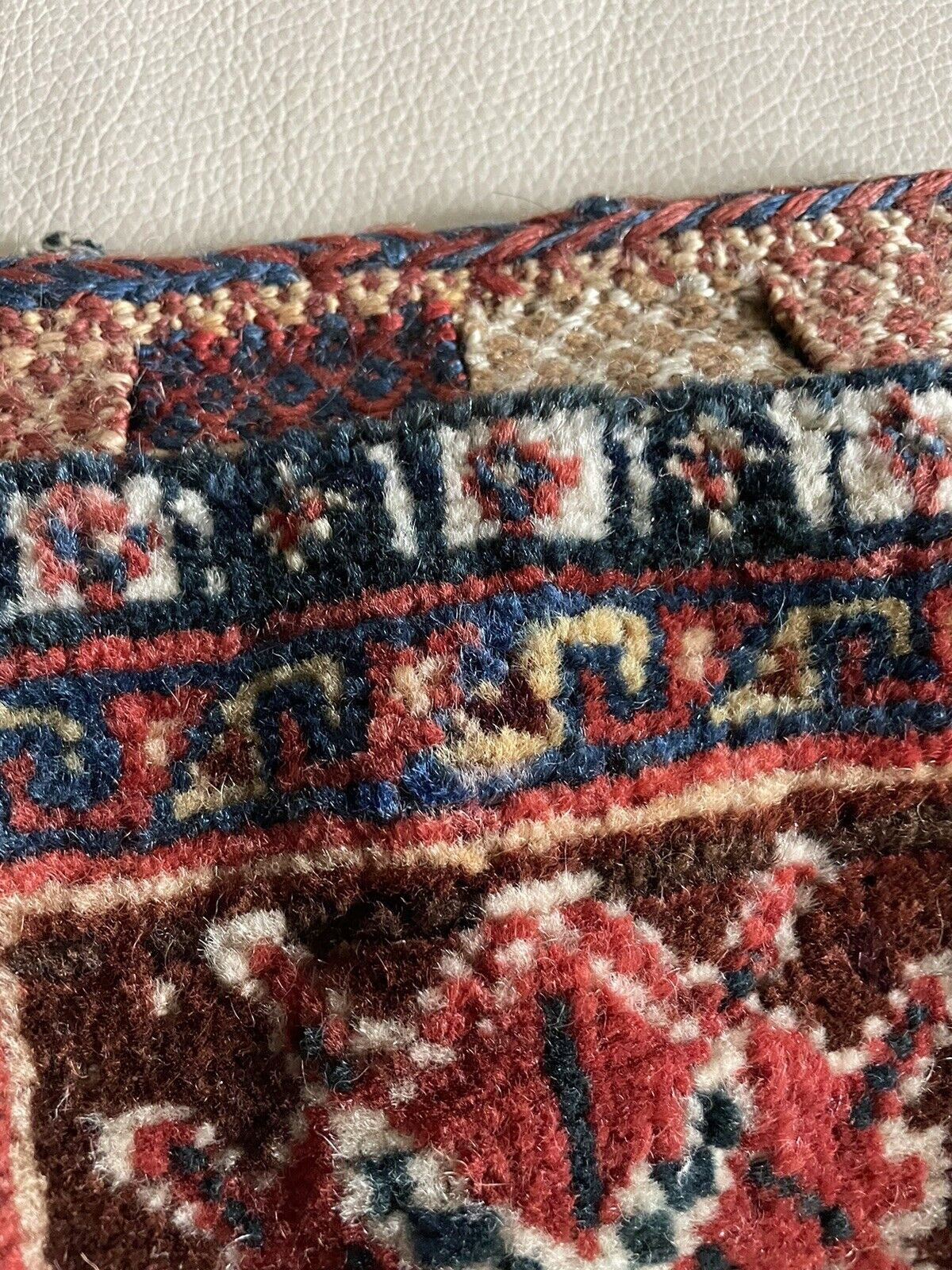 Close-up of the floral elements within the bag's design.