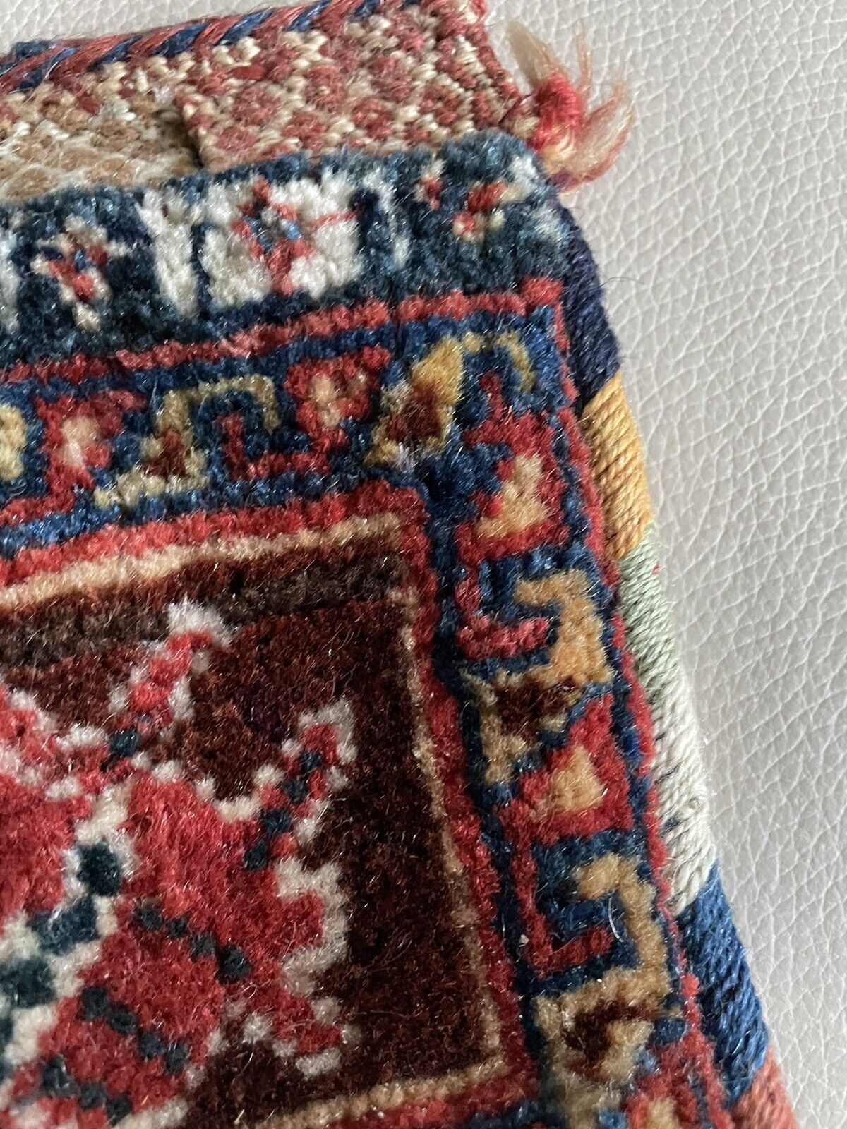 Top view of the open handmade antique Persian Gashkai small bag (1900s) showcasing the interior.