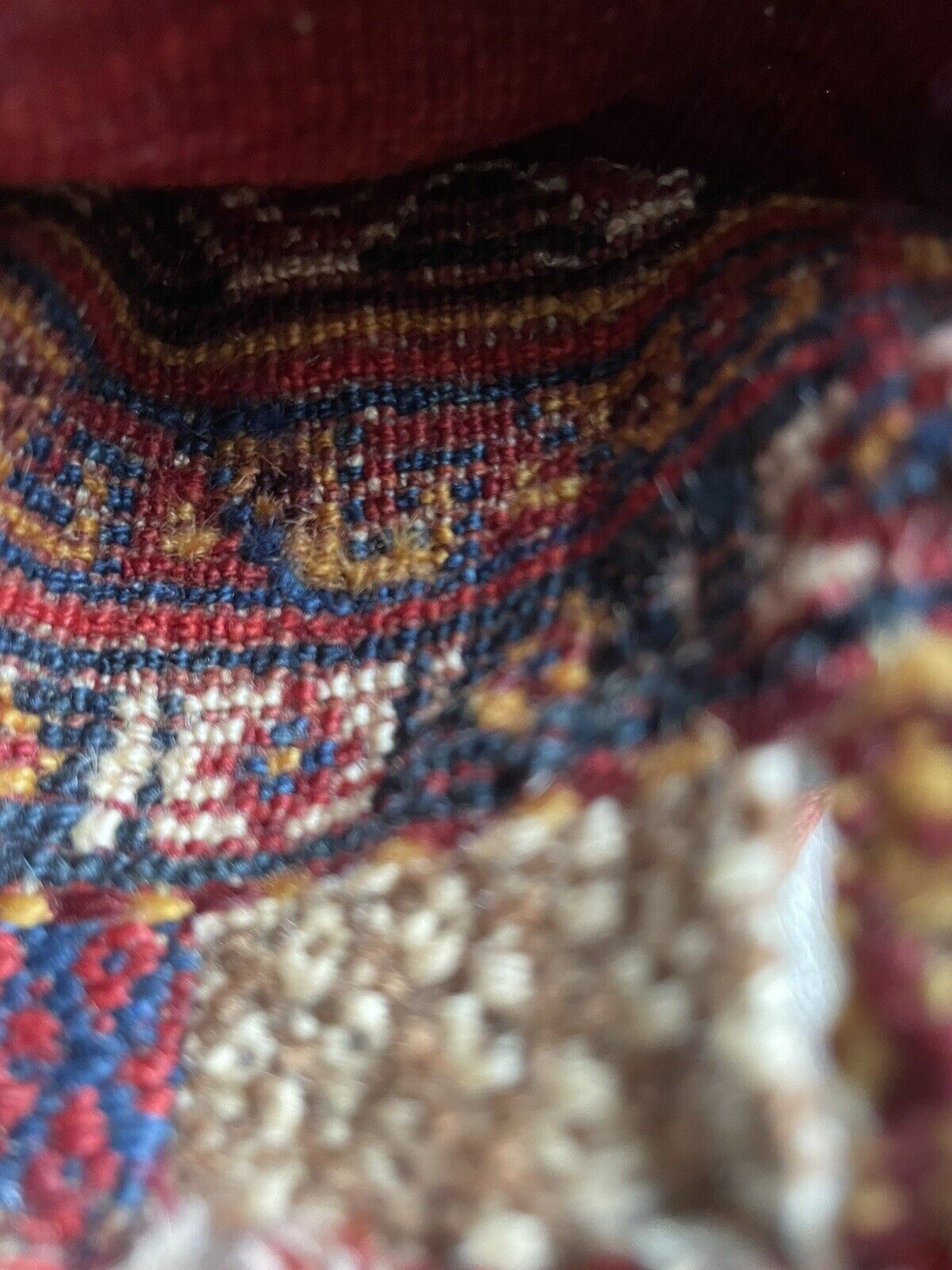 Backside of a handmade antique Persian Gashkai small bag (1900s) crafted from high-quality wool in good condition.