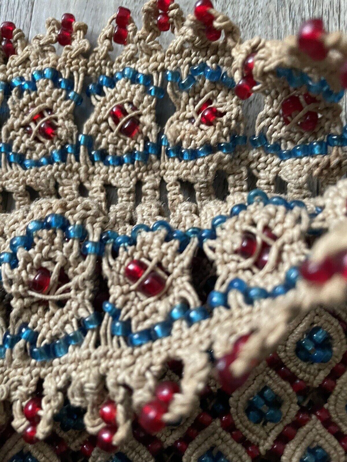 The handmade vintage Malian bag (1960s) held in hand, showcasing its practical size (7" x 11" or 20cm x 29cm) and its potential as a stylish everyday accessory.