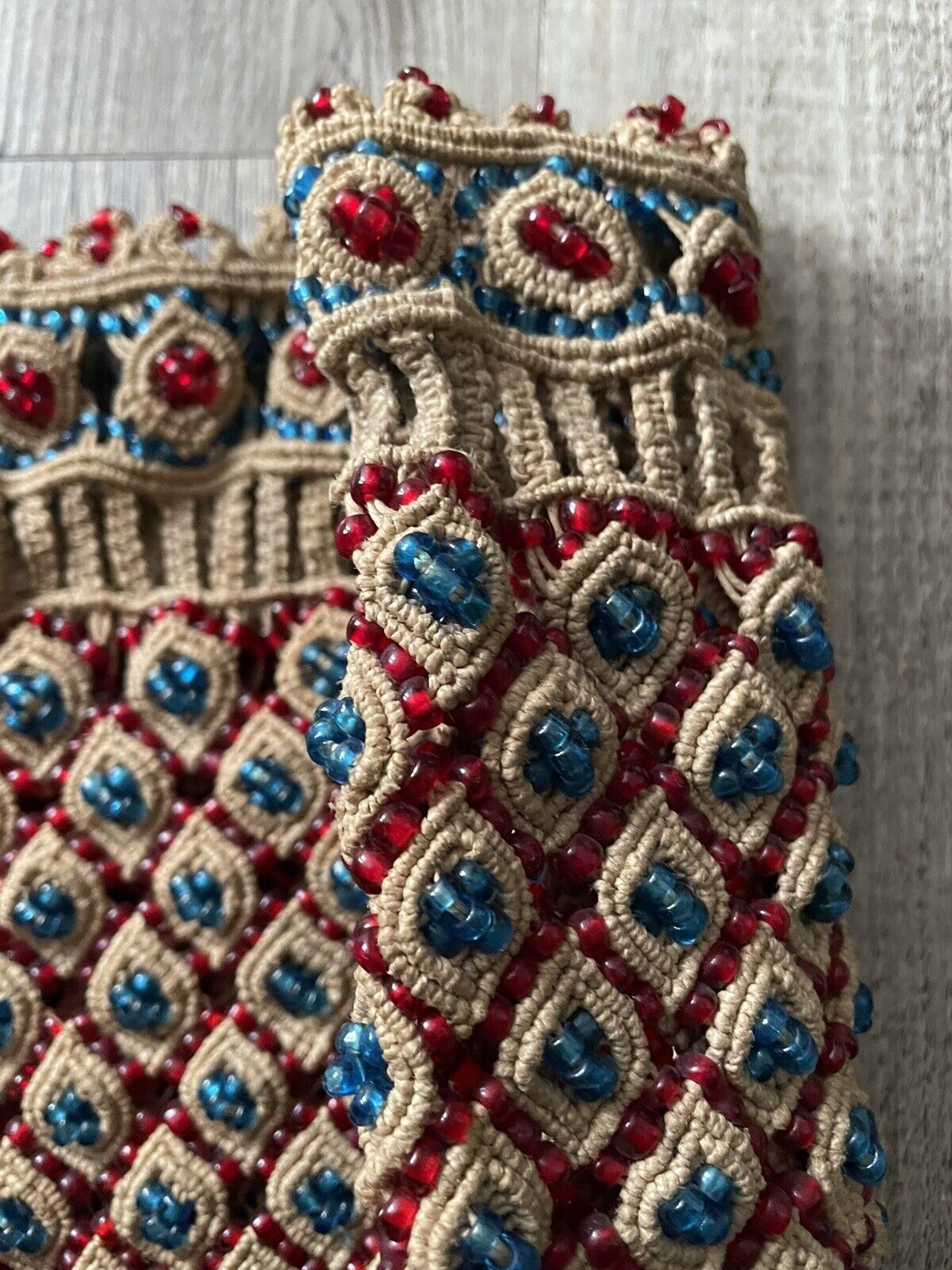 The handmade vintage Malian bag (1960s) styled with a bohemian outfit, showcasing its versatility and ability to complement various fashion aesthetics.