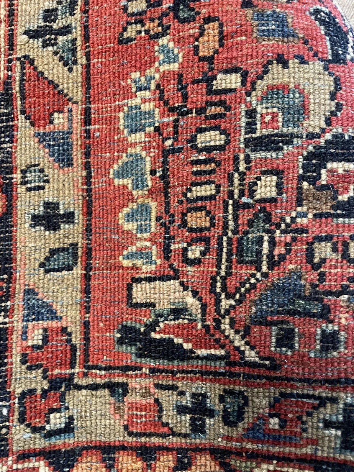 Well-preserved antique Sarouk carpet from the Middle East, circa 1920s, showing a lustrous dense wool pile and a generous navy main border with palmette blossoms.

