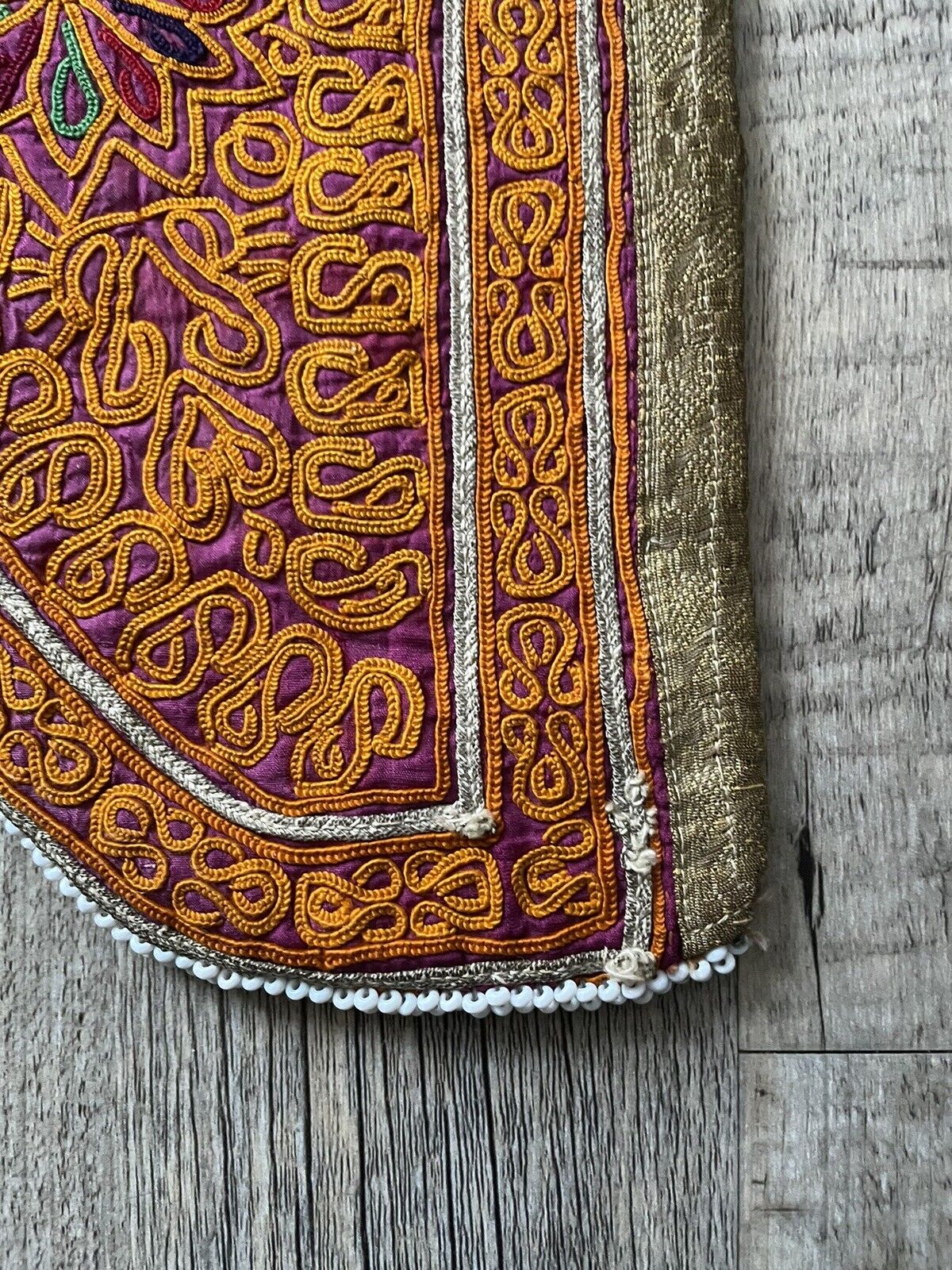 A close-up of any unique markings or imperfections on the bag, signifying its age and authenticity.