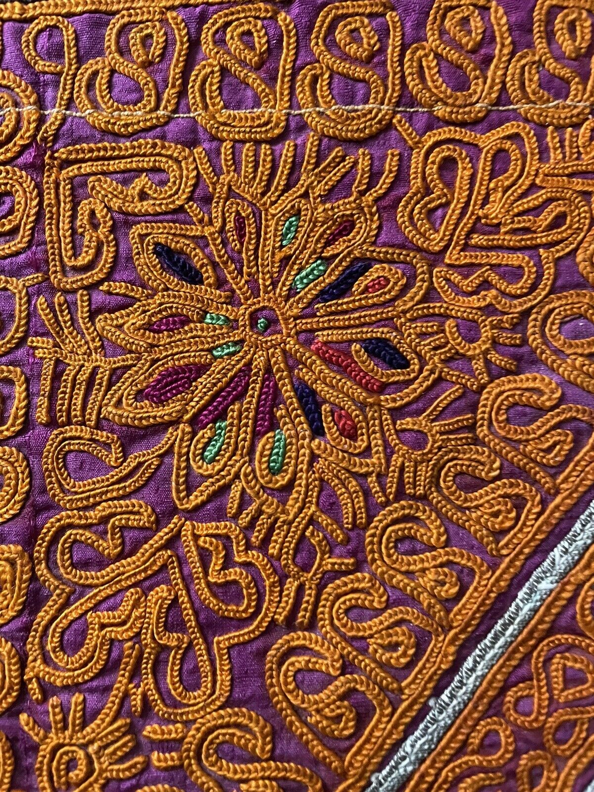 Top view of the open handmade antique Uzbek Suzani collectible bag (1920s) showcasing the interior.