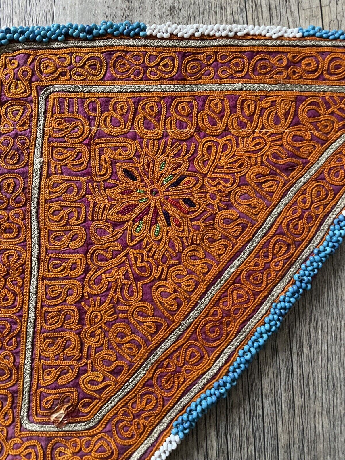Bottom view of the handmade antique Uzbek Suzani collectible bag (1920s) highlighting the base.