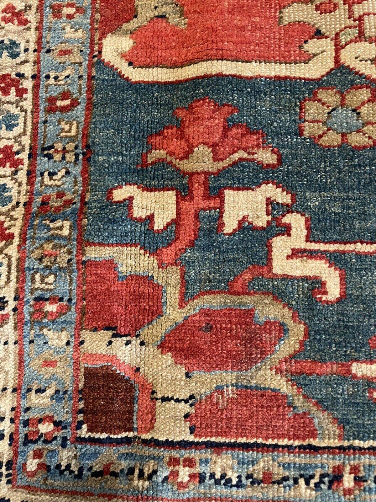 A close-up of the rug's selvage (edge), showcasing the woven construction and the use of natural fibers for durability.