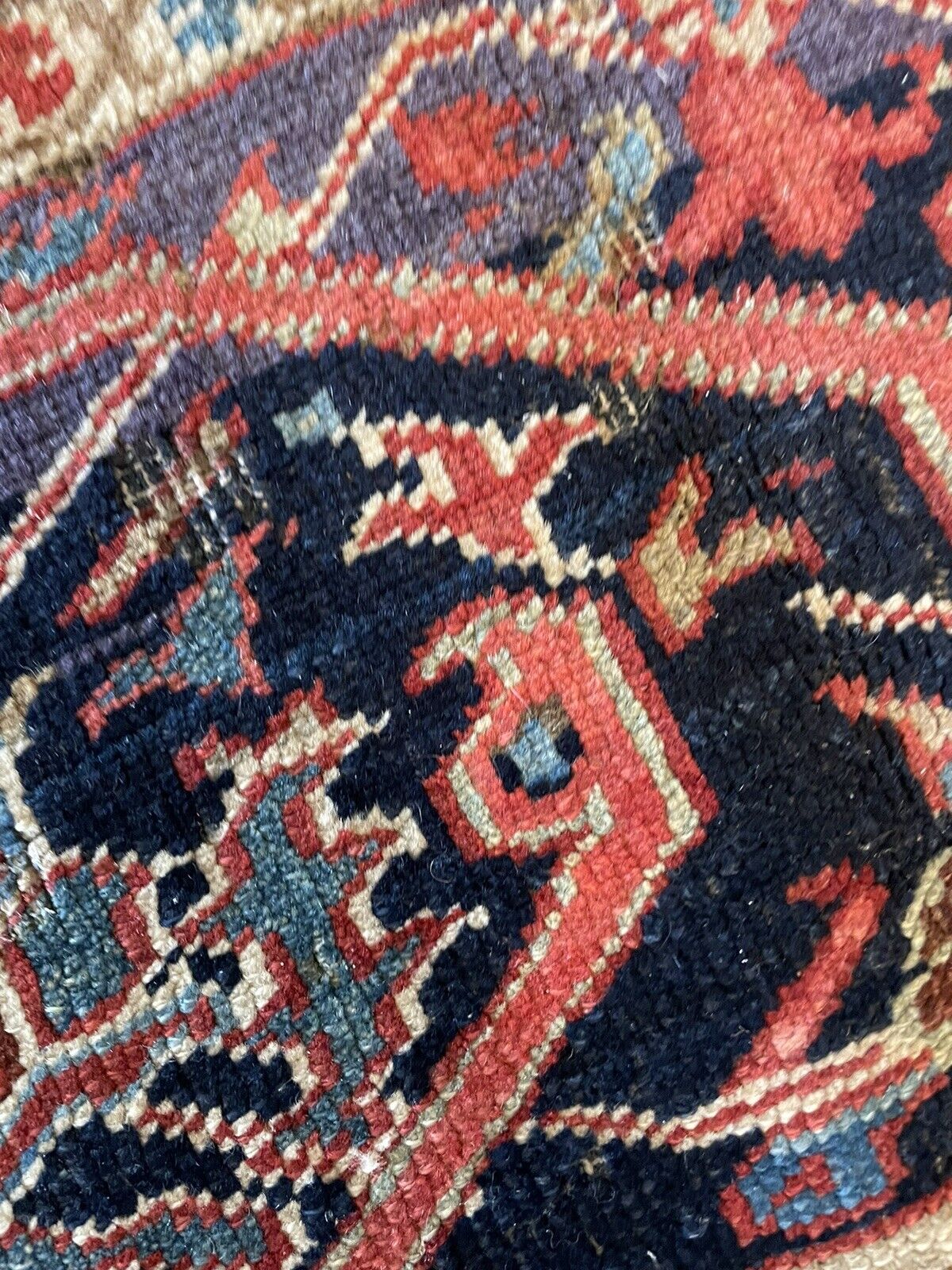 A lifestyle image featuring the rug placed in a living room setting with comfortable seating, creating a warm and inviting atmosphere.