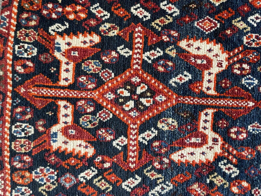 Full Saddle Bag: A handcrafted antique Persian Gashgai saddle bag (1.7' x 3.5') in its entirety, showcasing traditional geometric patterns and vibrant colors.