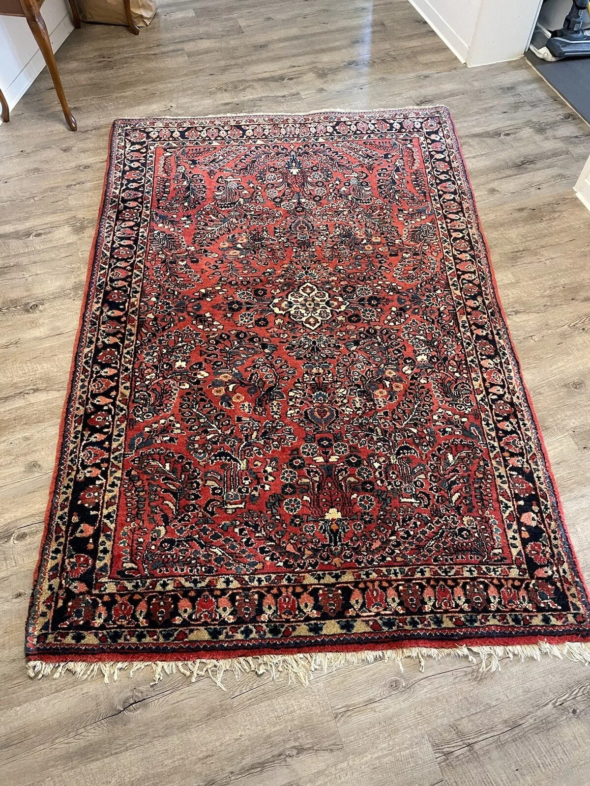 Antique Persian Wool Rug with Intricate Floral Patterns
