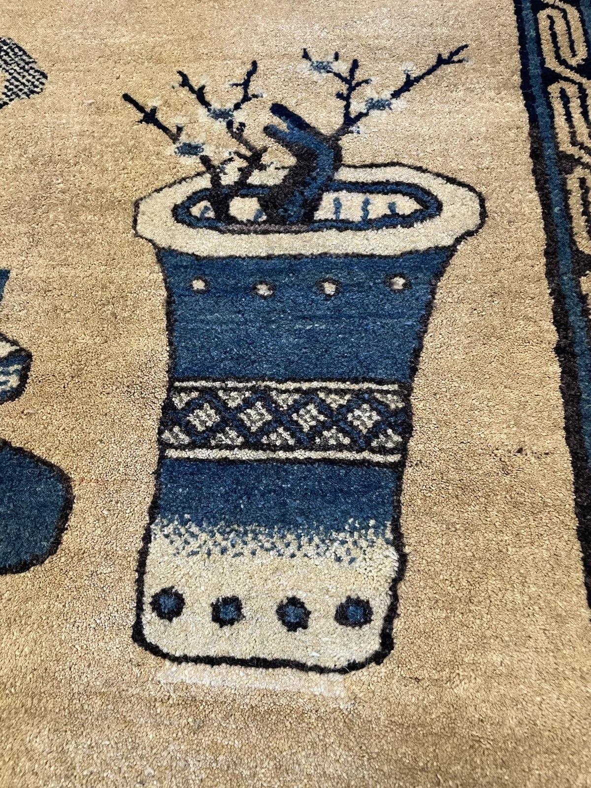 Detailed border pattern on a vintage Peking rug
