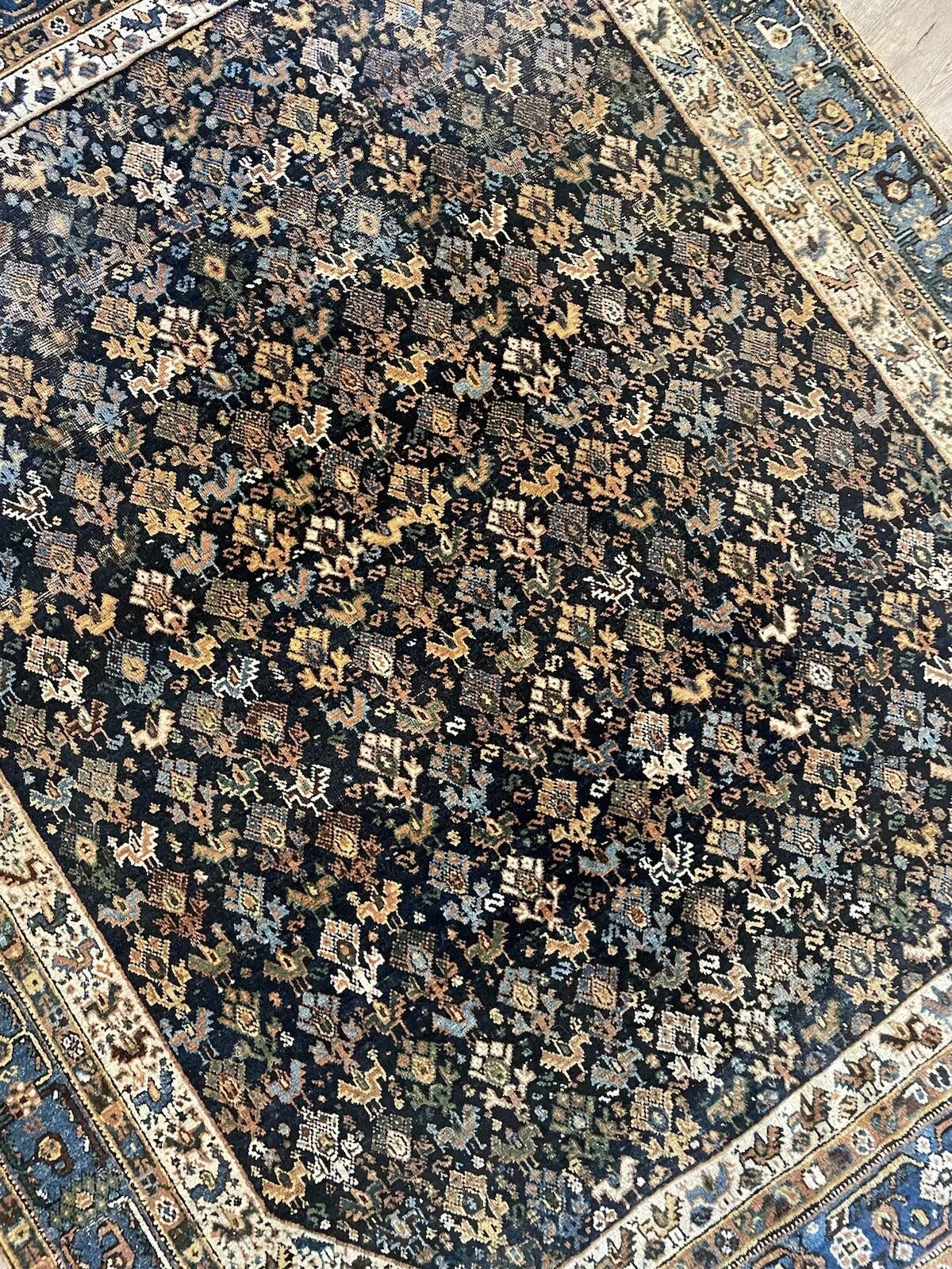 Vintage Middle Eastern wool rug featuring warm earth tones
