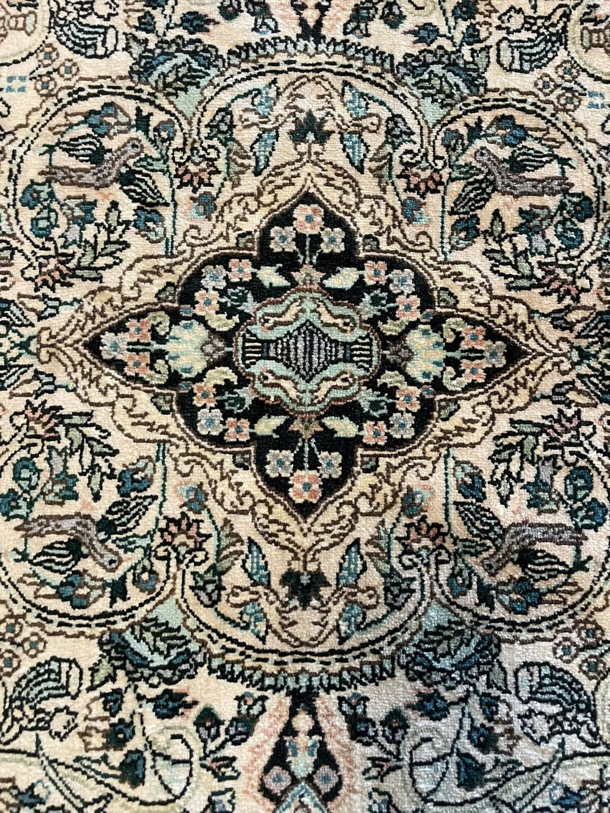Elegant blue and beige vintage silk rug with red accents
