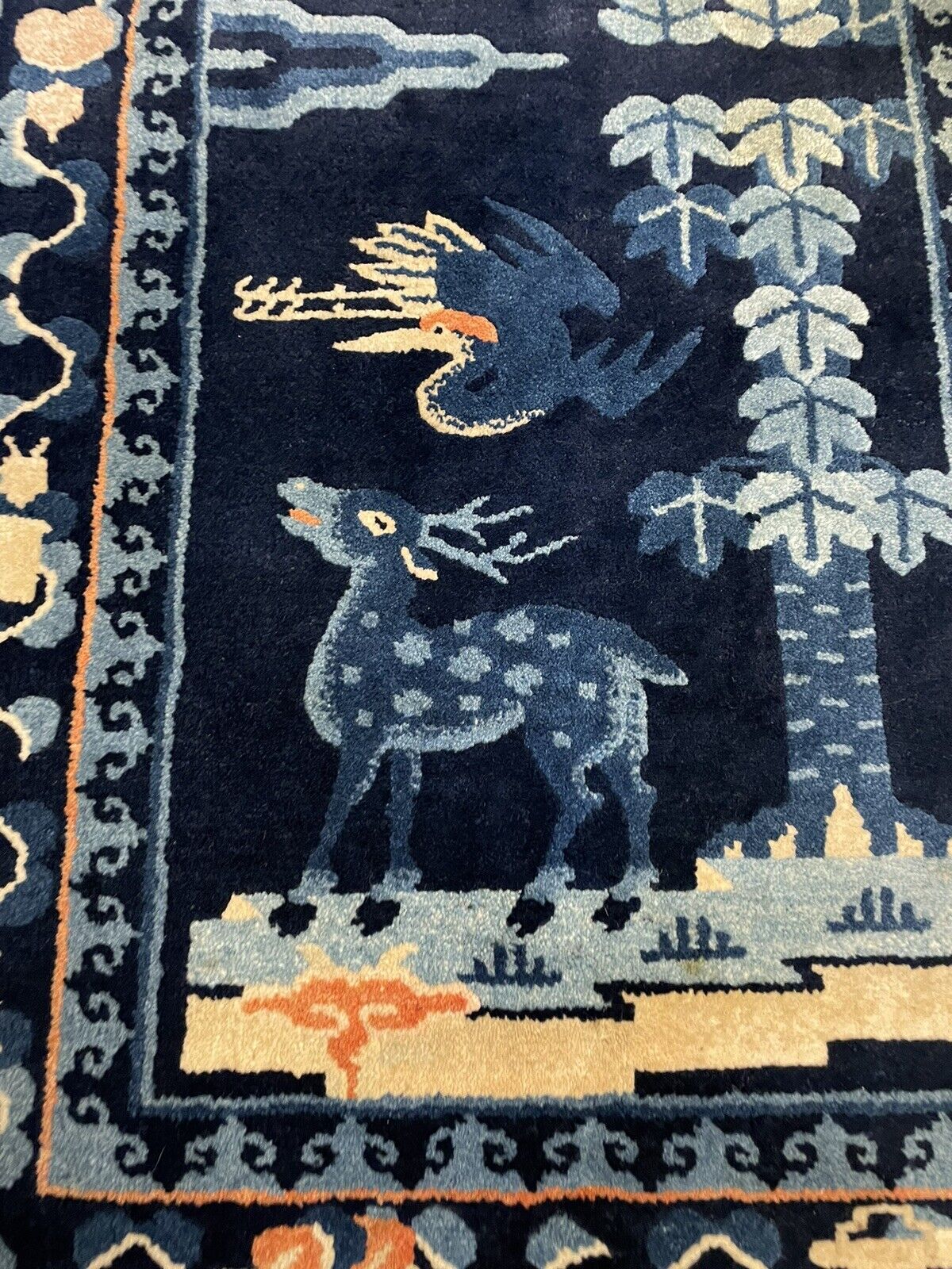 Traditional Chinese Peking rug with intricate border designs
