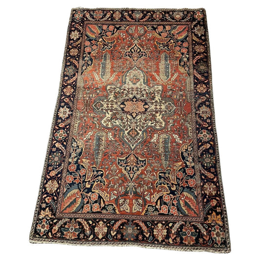 Handmade antique Persian Farahan wool rug from the 1870s
