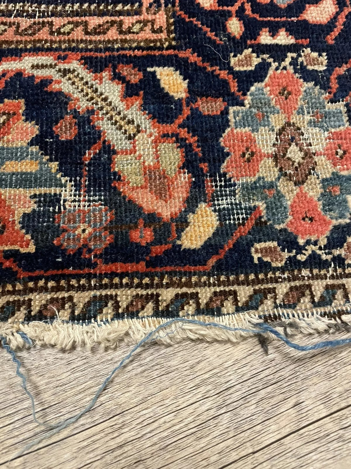 Elegant handmade Persian carpet with rich red and blue tones
